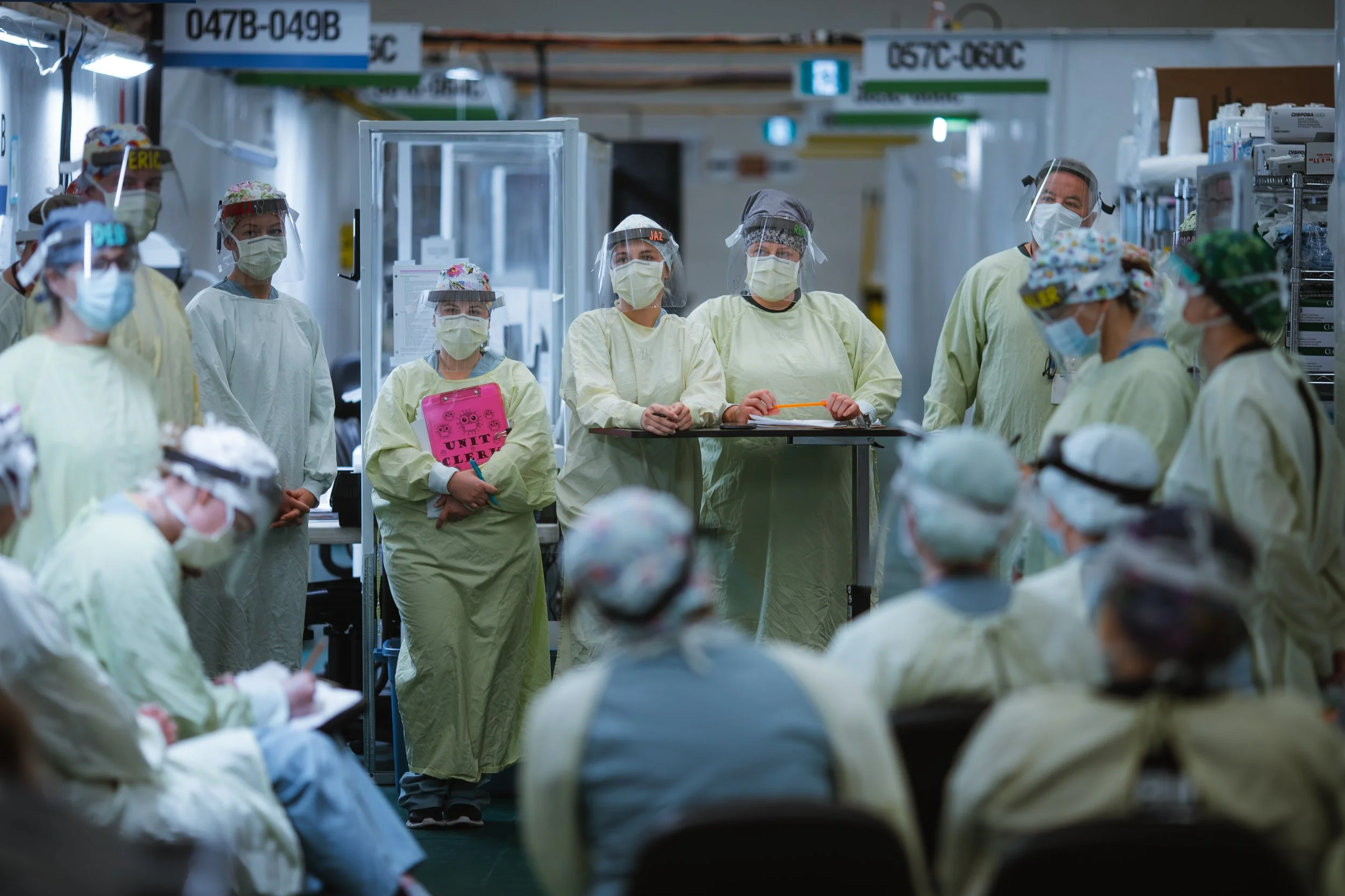 Frontline medical staff hold a meeting at the Windsor Regional Hospital Field Hospital at the St. Clair College SportsPlex, during the COVID-19 pandemic (for the Windsor Star, 2020). 