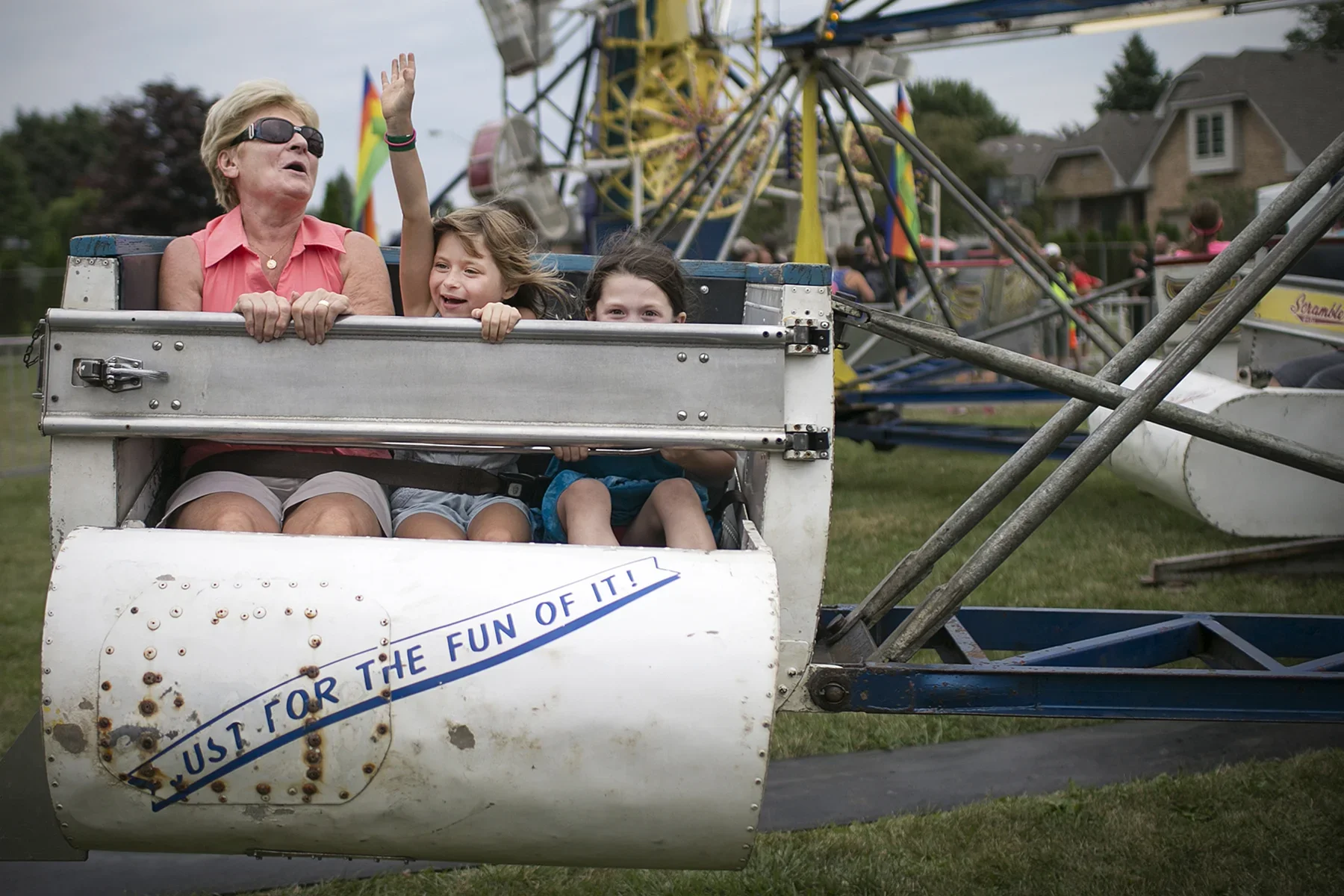  Rejeanne Wengrzynski, left, rides the Scrambler with her granddaughter, Naddy Gombar, 7, and Naddy's friend, Livia McIndoe, 5, at the Tecumseh Corn Festival (for the Windsor Star, 2015). 