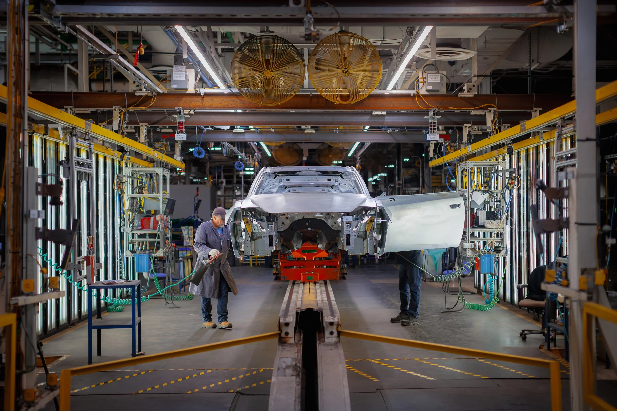 Workers at the Windsor Assembly Plant assemble the all-electric Dodge Charger Daytona (for Stellantis North America, 2024). 