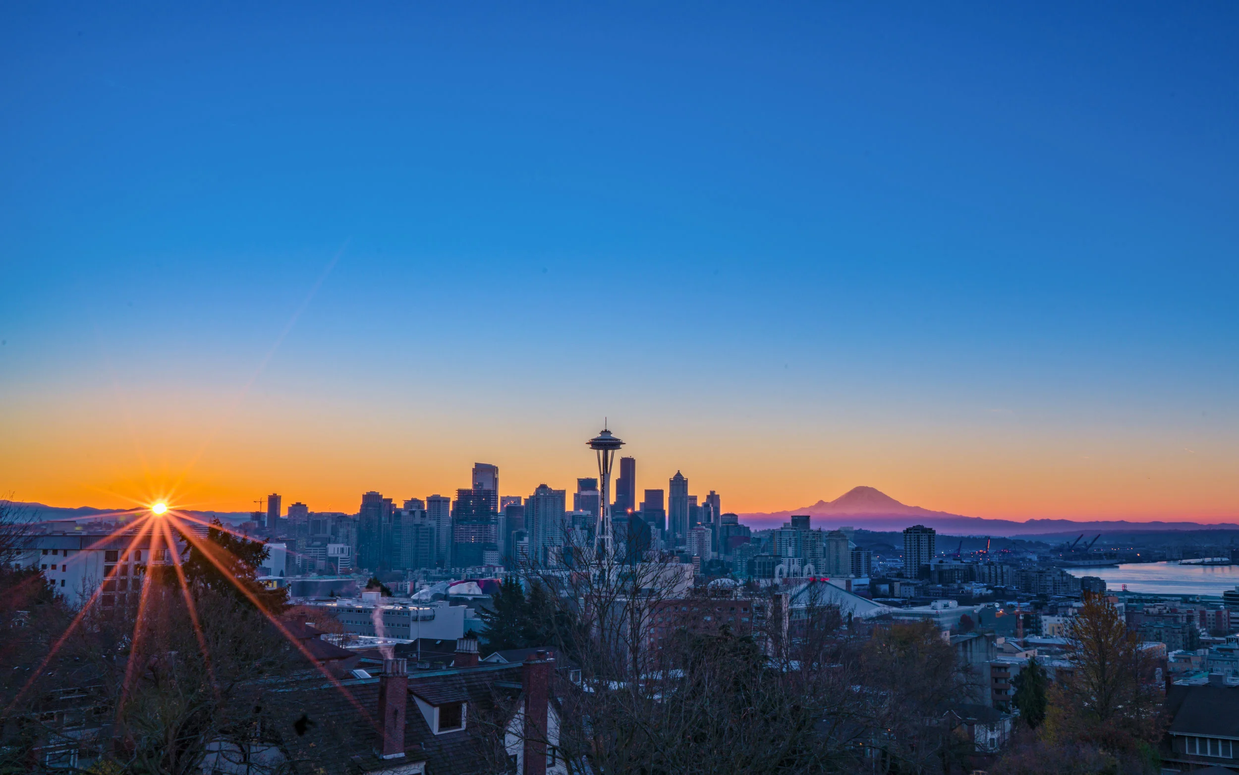 AdobeStock_150240375 seattle space needle sunrise mount rainier.jpeg