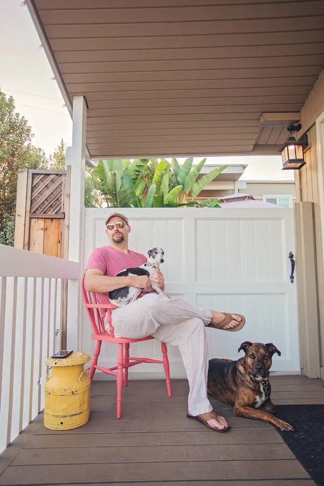 My best friend’s husband Sam pictured on the chair, his true love, Luna on his lap and guard dog, Xollin.