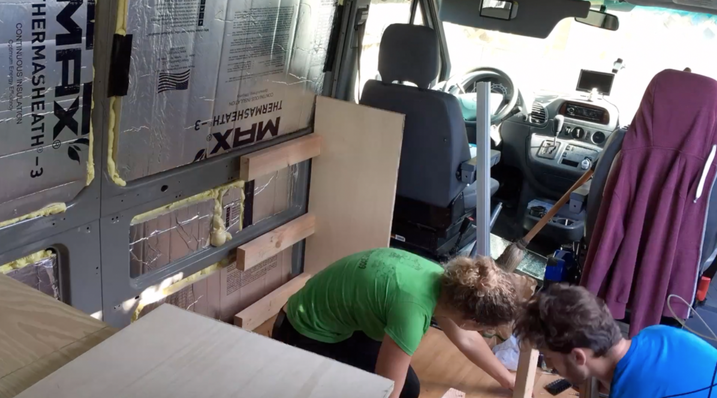 2x4's separate the cabinets and is screwed to the van wall