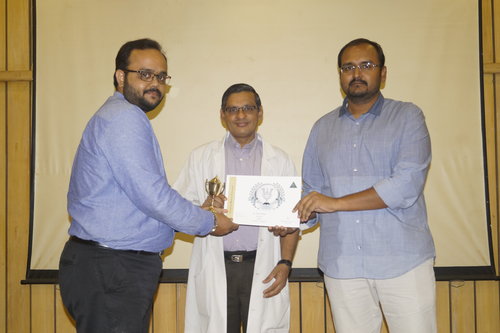 Dr.Vivek Narayan getting the ‘Workaholic staff award’ for the year 2017 from the Director of Academics