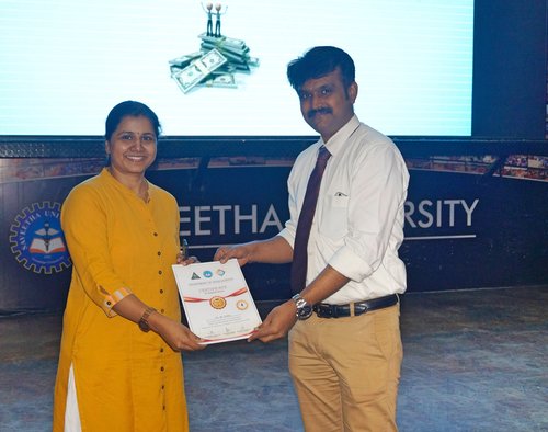 Dr.Subha being honoured by the Head of the Department of Orthodontics for conducting a quiz contest in a CDE programme by the Orthodontics department