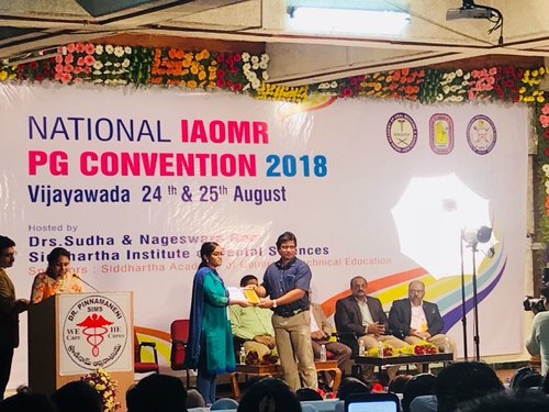 Post graduate student Dr.K.V.Swathi getting the ‘Best Paper Award’ for the paper on ‘Comparison of the effectiveness of chemiluminescence with lugol iodine versus chemiluminescence with toluidine blue in the diagnosis of dysplasia in tobacco associated oral lesions -A pilot study’ in National PG Convention 2018 held at Vijayawada