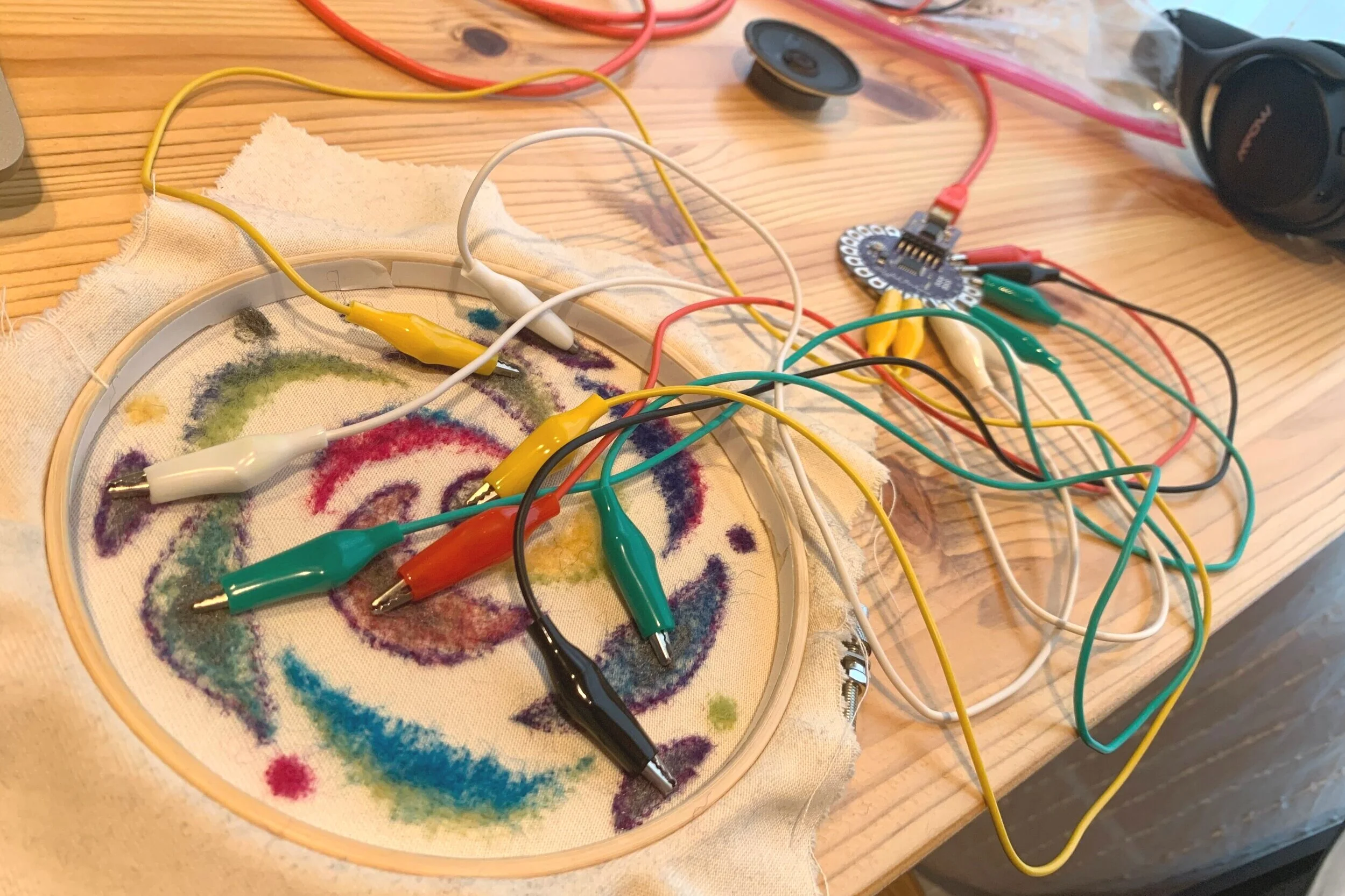 The back of the piece, with connections to the Arduino Lilypad.