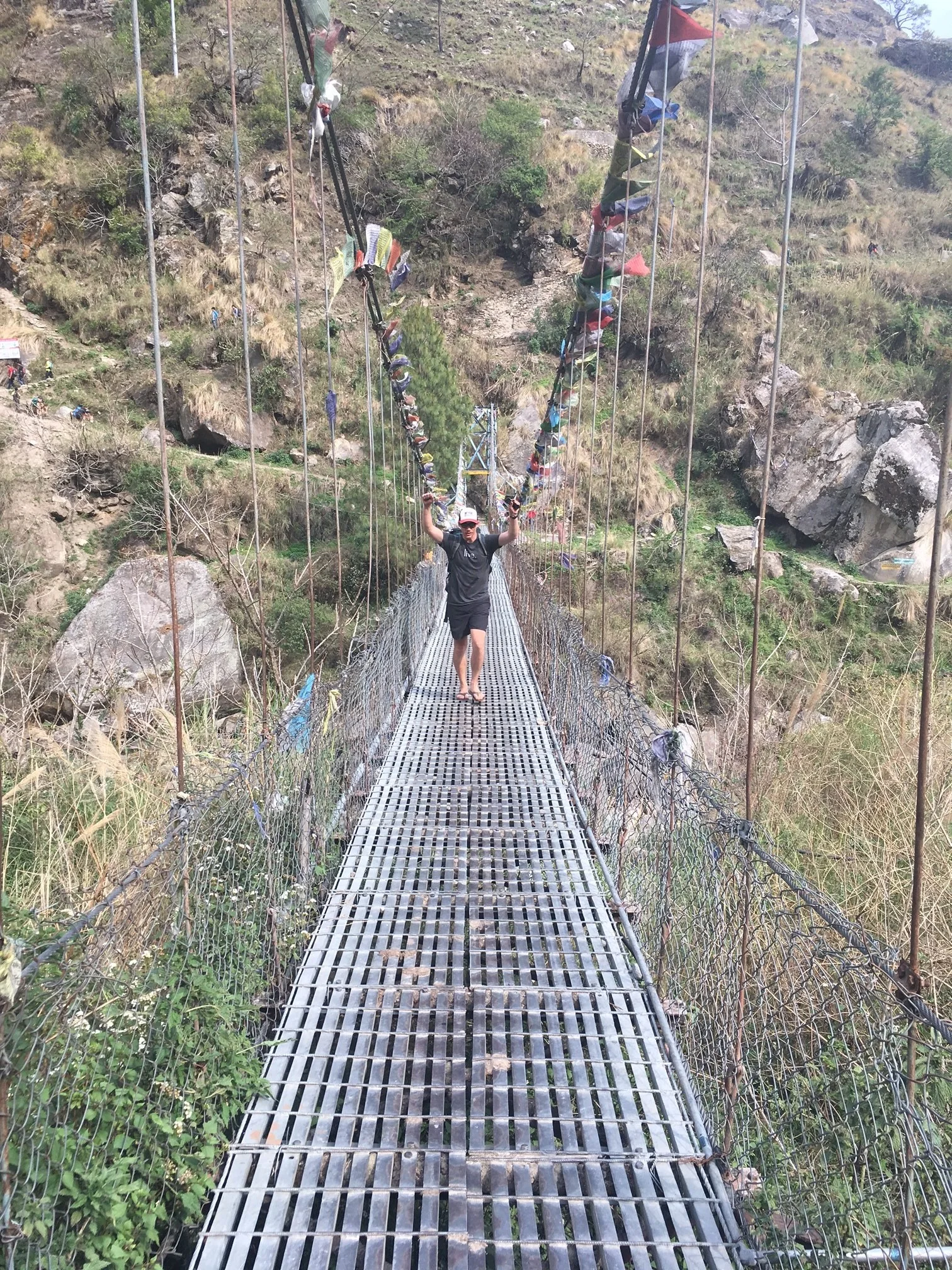 Enjoying the feeling of a trek well done on the final bridge before the ride back to KTM.