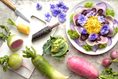 Purple radish salad,vegetables and cutting board