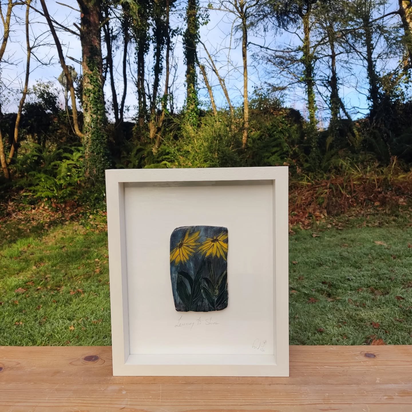 This piece captures the quiet, steady practice of stepping into your own light.

The deep textured background is a reminder of the "shadows" and life experiences that shape us. But here, the focus has shifted. Two vibrant yellow flowers ris