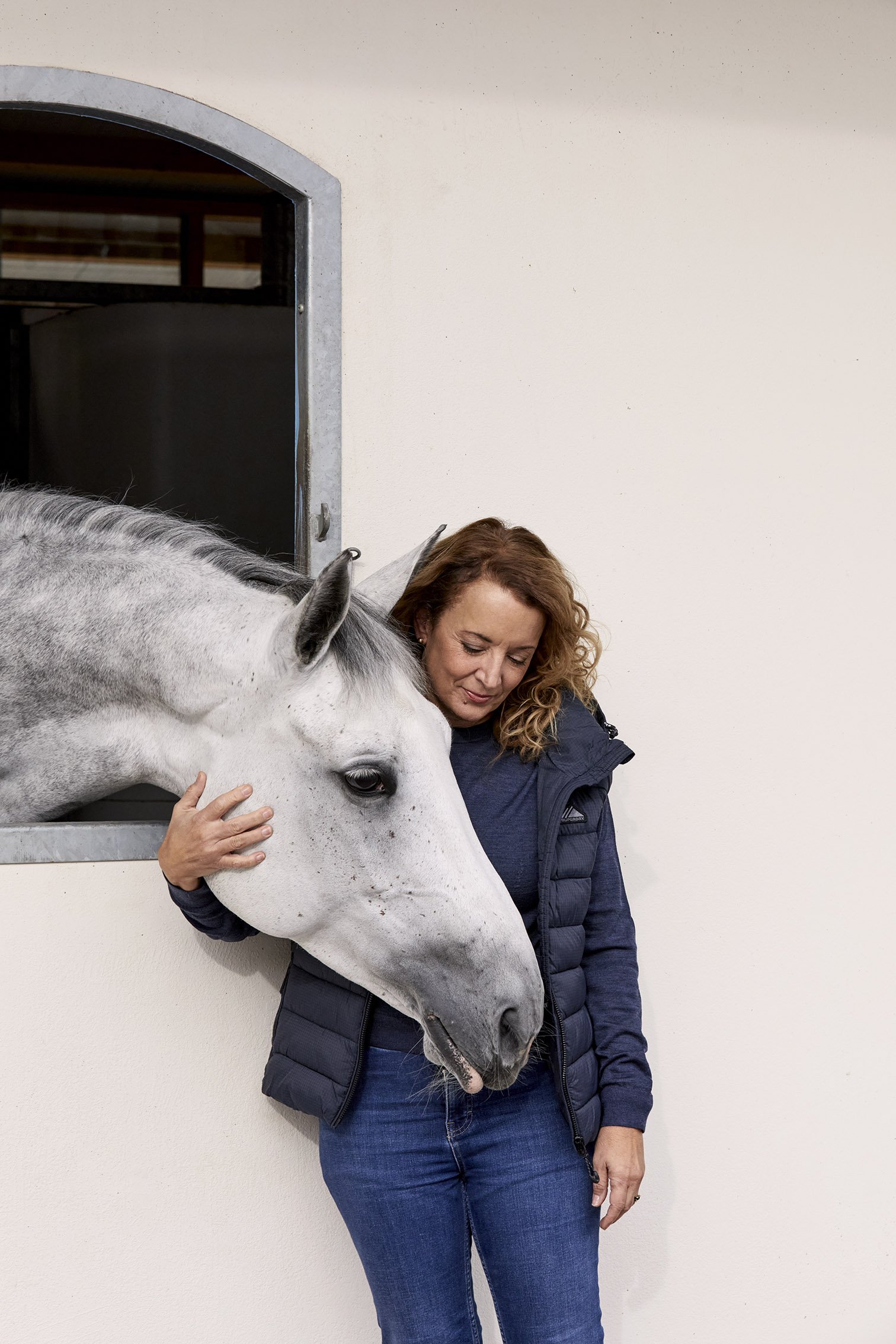 Portrait of Sabrina Ibanez, Secretary General of the FEI, with a horse