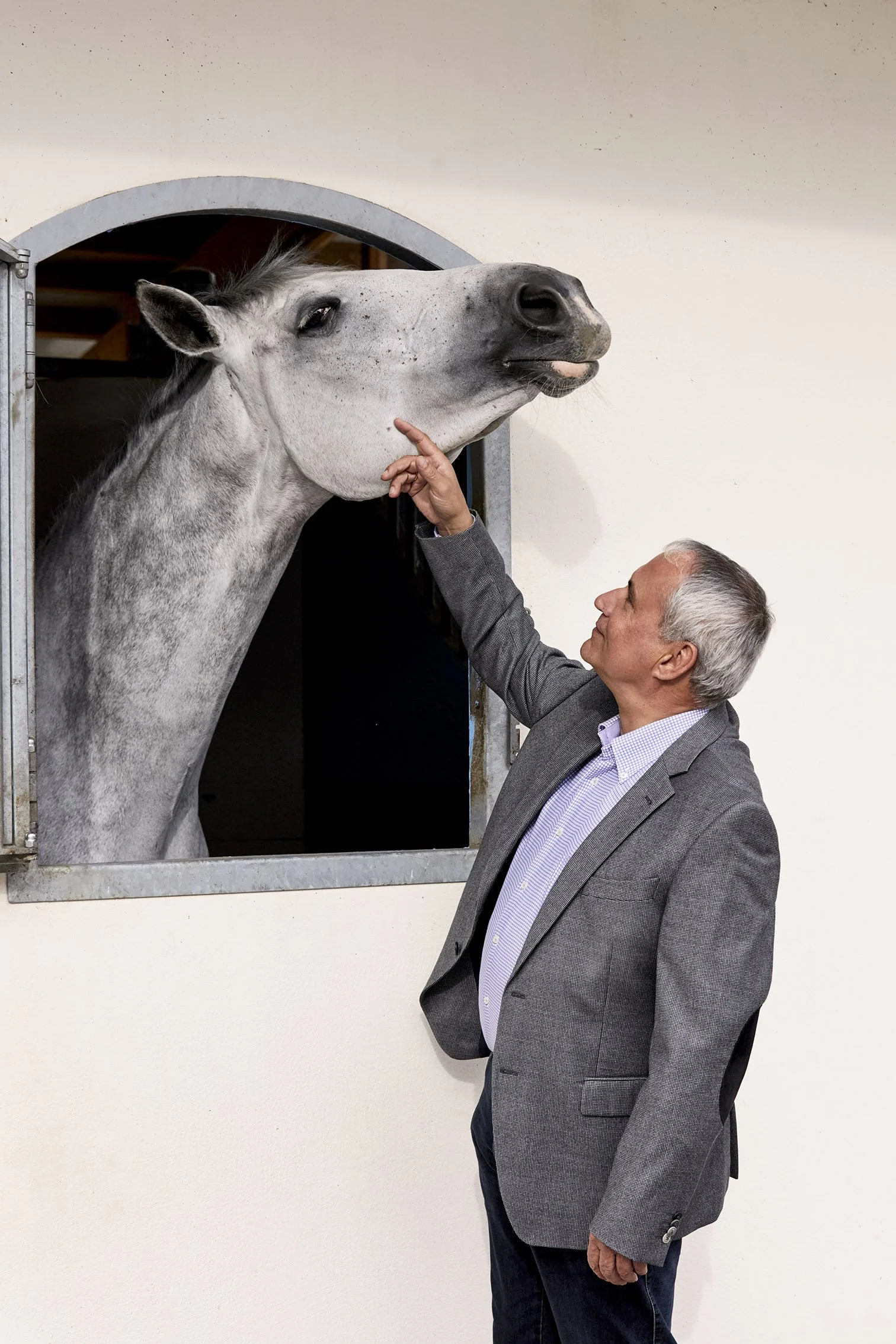 Ingmar De Vos, President of the FEI with a horse