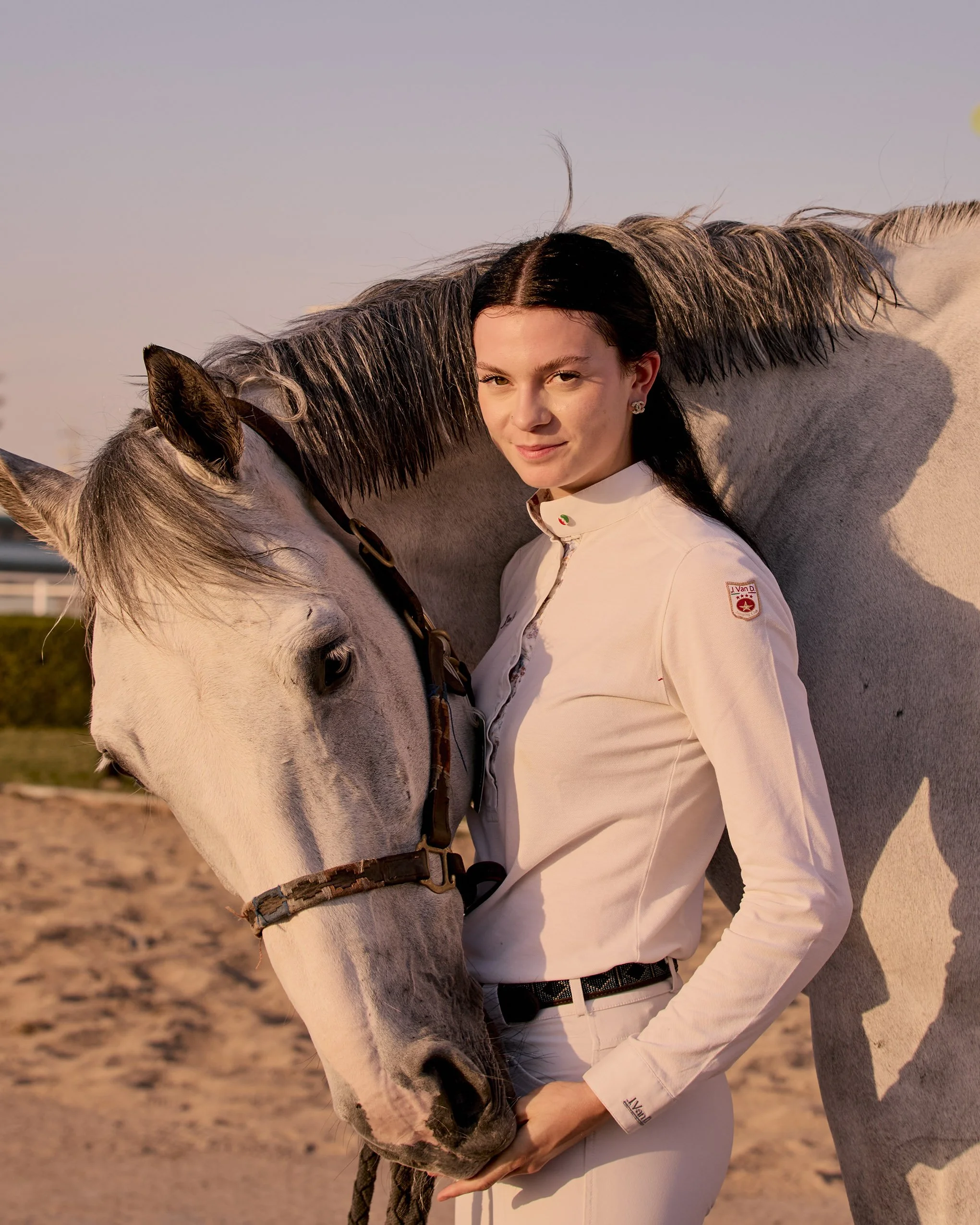 White horse with rider dressed in white