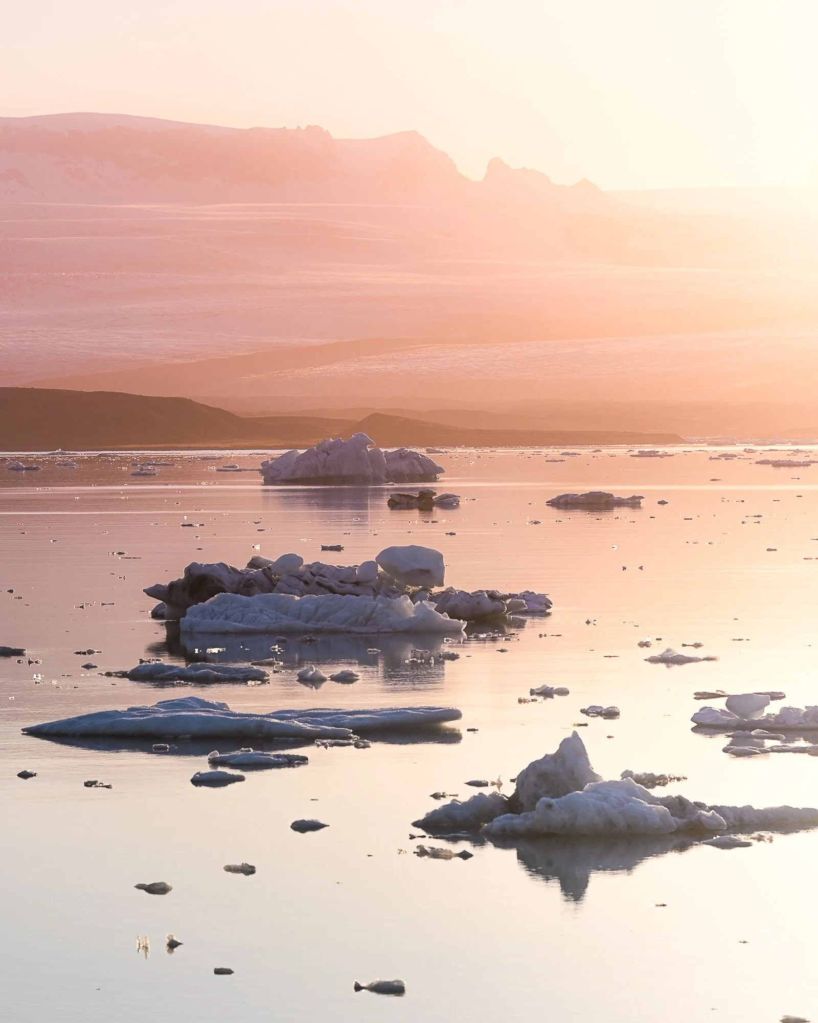 Jökulsárlón Glacier Lagoon at sunset with floating icebergs Iceland