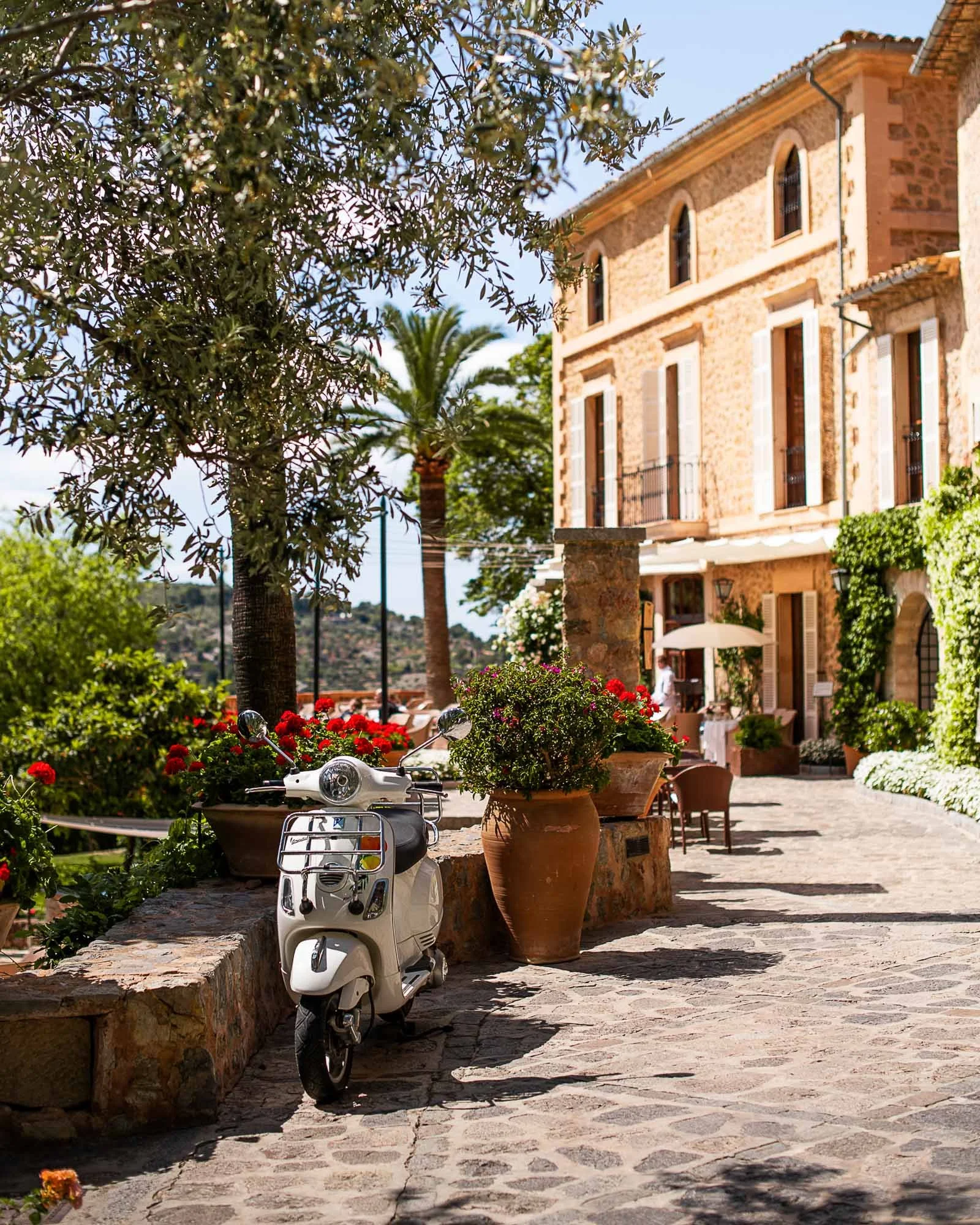 Belmond La Residencia Deià Mallorca luxury hotel exterior Tramuntana mountains stone buildings olive groves boutique hotel Mallorca Spain