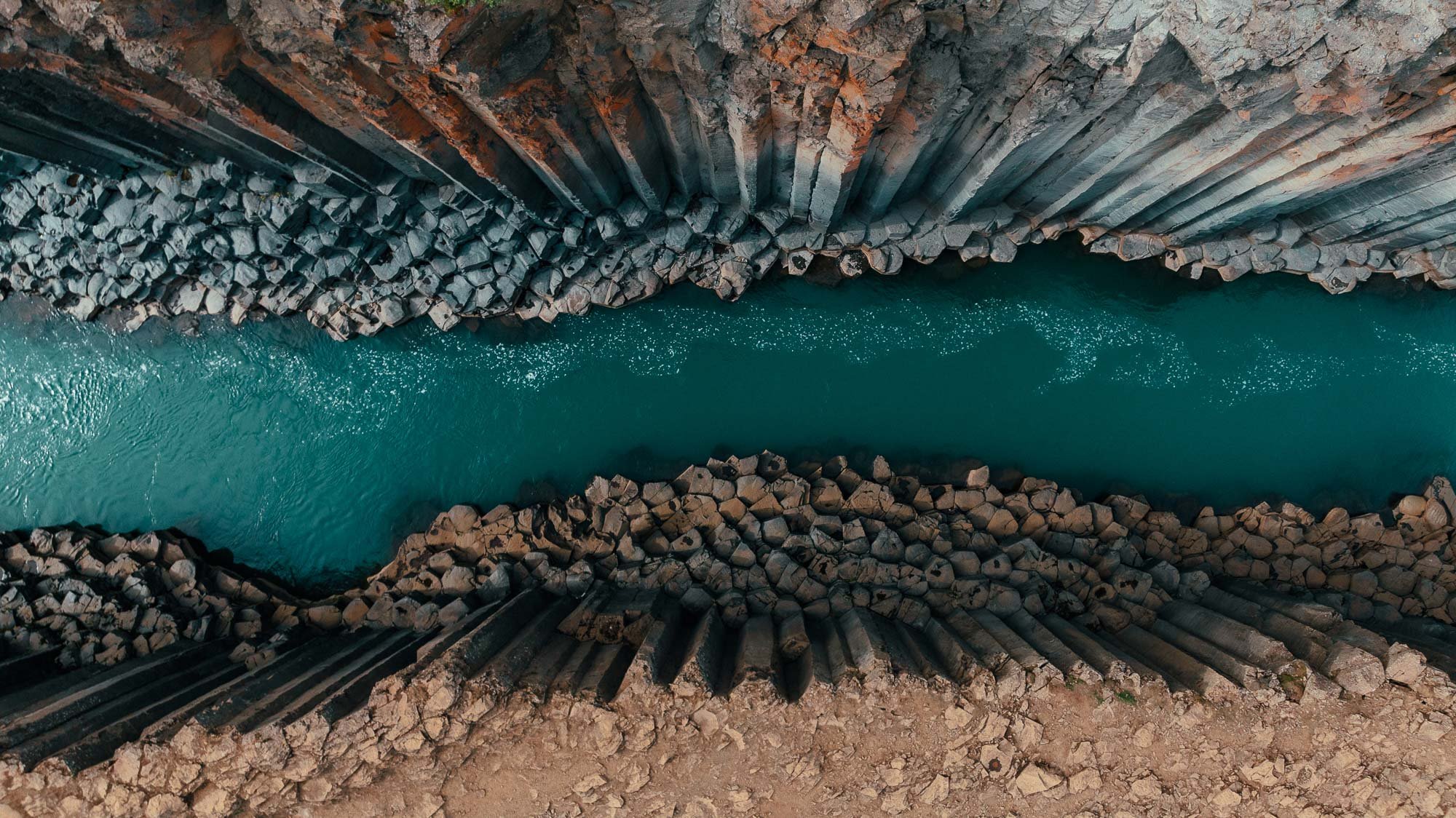 Drone view of Stuðlagil Canyon Iceland with turquoise river and basalt columns Iceland