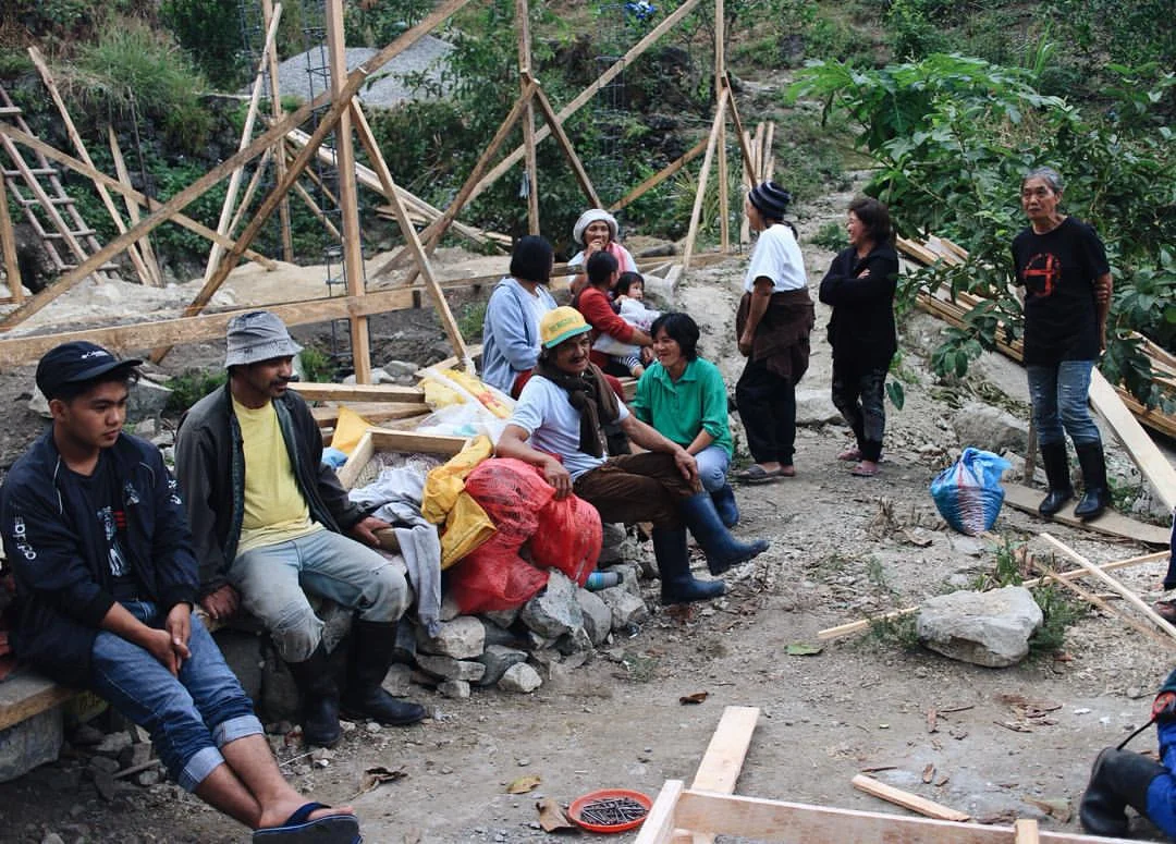 Farmers delivering their harvest while our mill was being constructed, circa 2015. (Photo courtesy of Kaye Lavin)