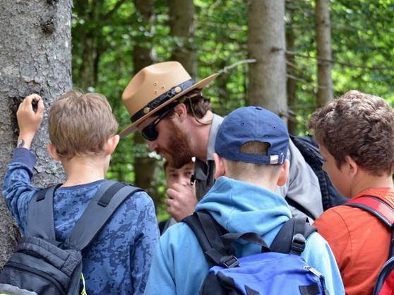  Ranger John Duwe teaches students to measure tree age at Triglav National Park, Slovenia. 