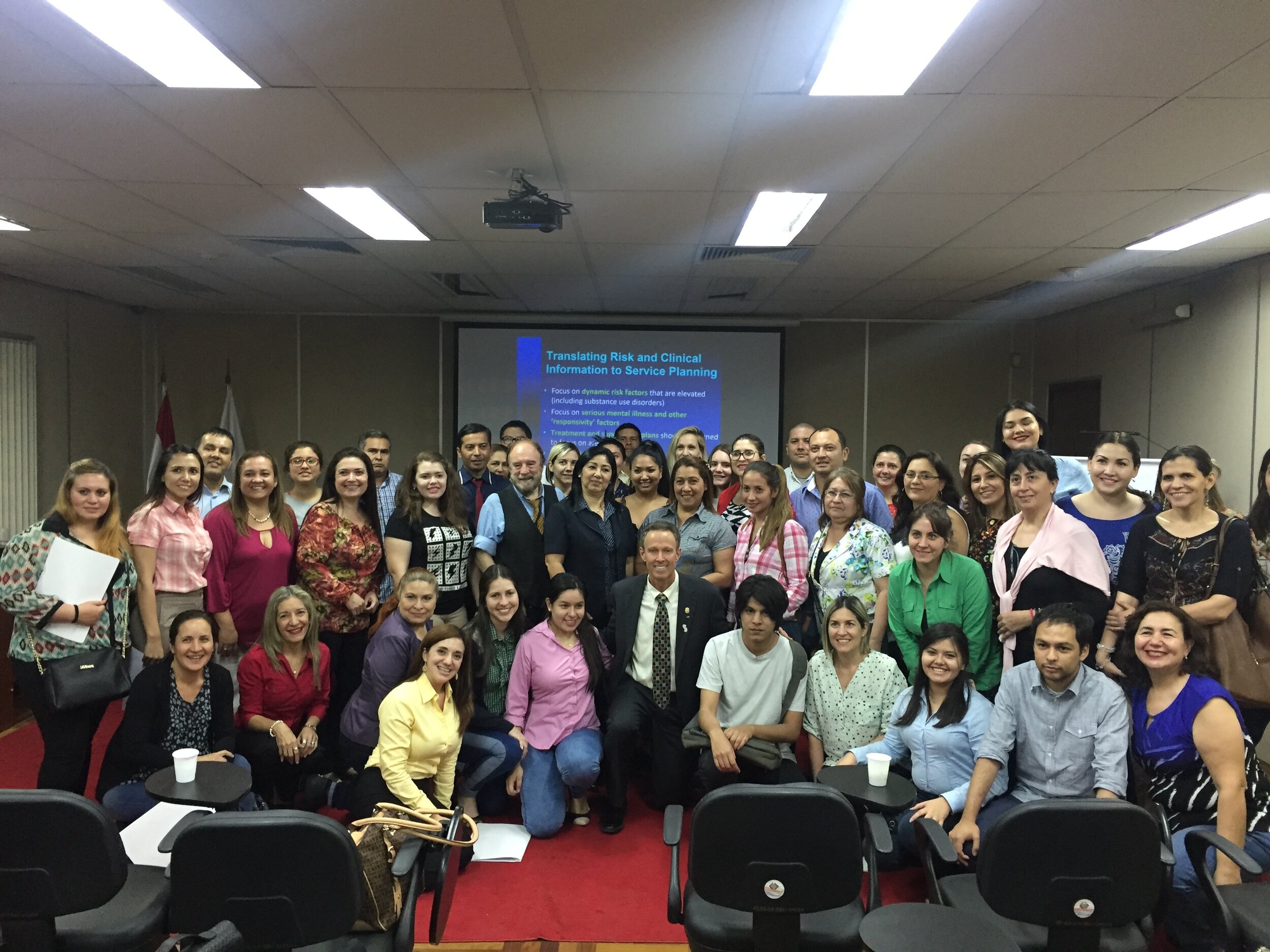Peters (first row, center) poses with participants after a successful workshop.