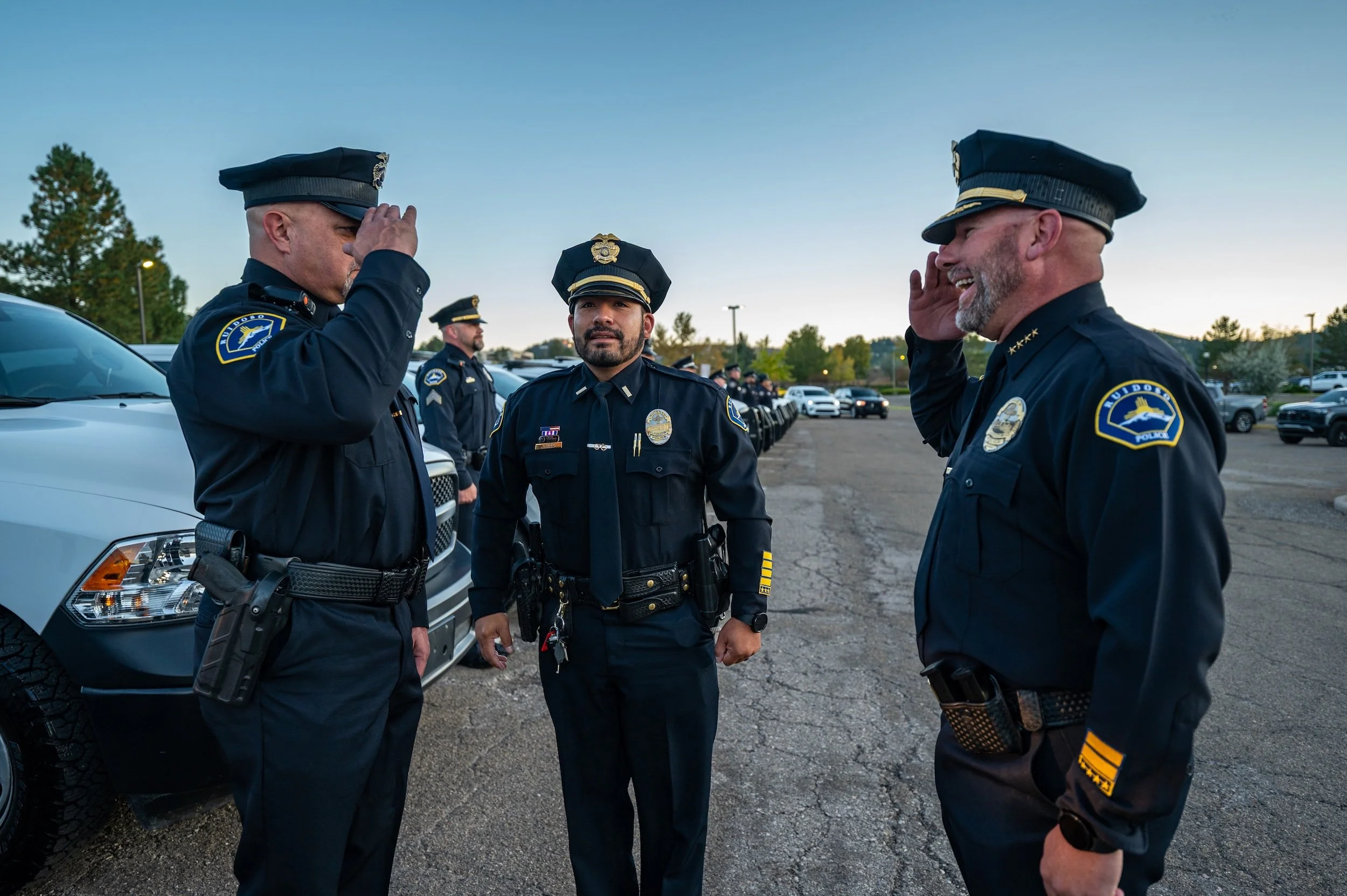 Photograph of Police Chief Steven Minner saluting Ruidoso Police Officers.