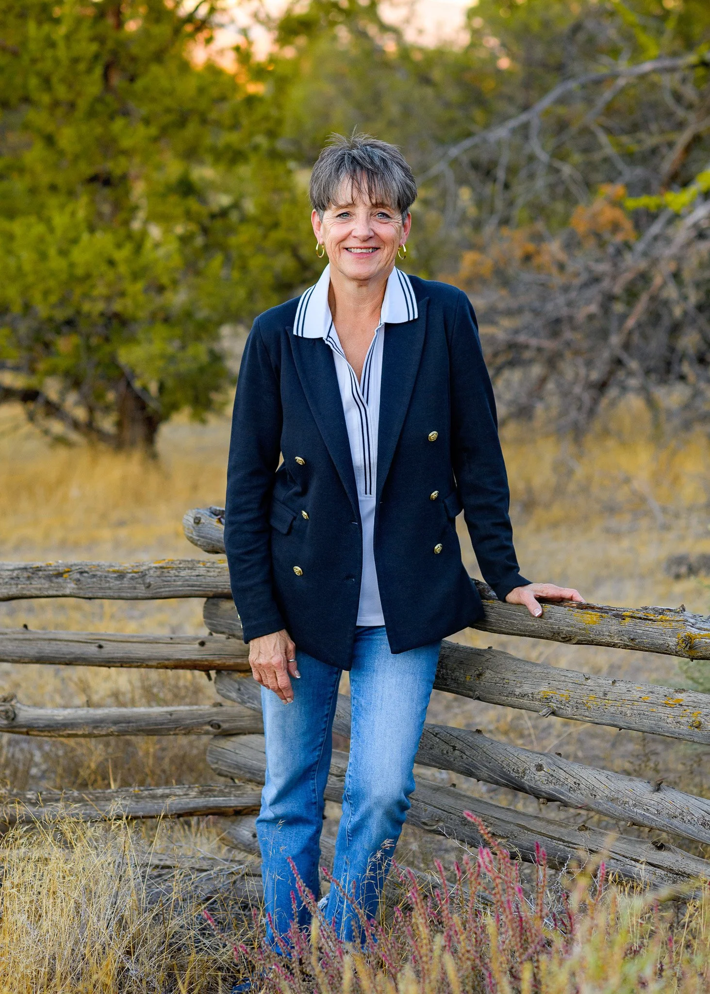 Outdoor professional headshot photo in Central Oregon with a mountain backdrop.