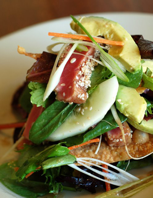 - Sesame Seared Tuna Salad with Field Greens, a Wonton Cracker, Cucumber, Avocado, Bean Sprouts, Scallions, and Shiitake Vinaigrette