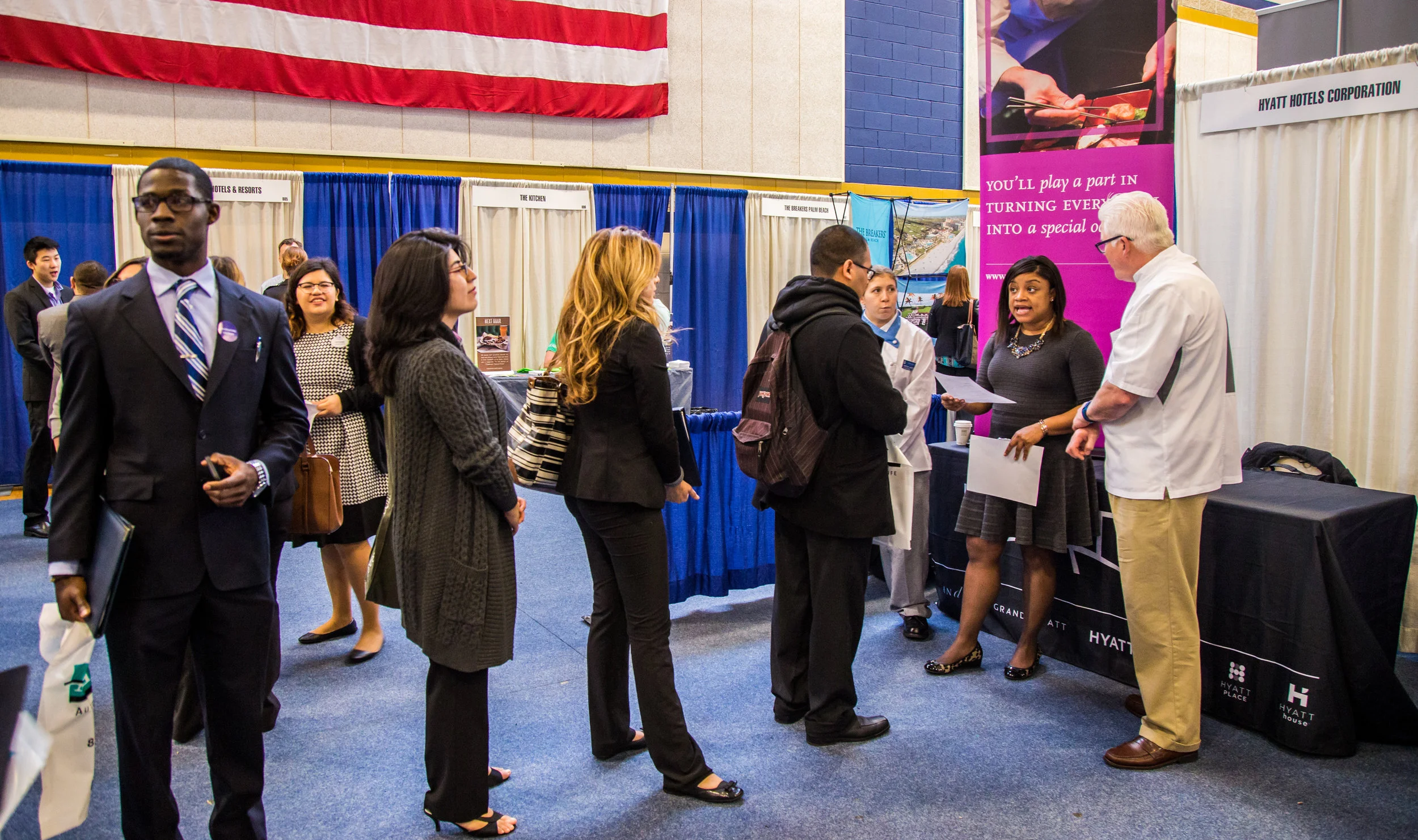 JWU students speak to Hyatt employees at a career fair.