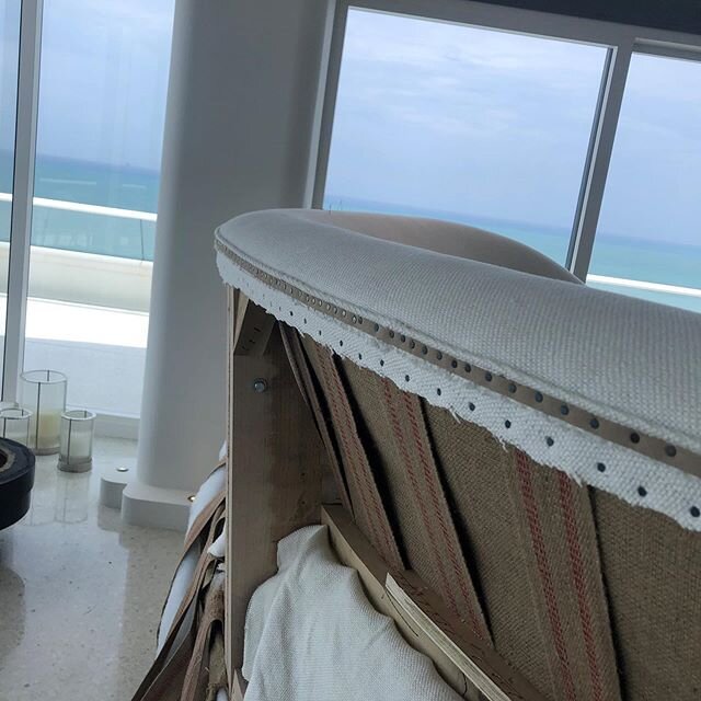 A teaser follow up on hoe you reupholster a sofa on site... it&rsquo;s challenging and views of the beach and water don&rsquo;t help! #customfurniture #spittingtacks #selfwelt #sunandsand