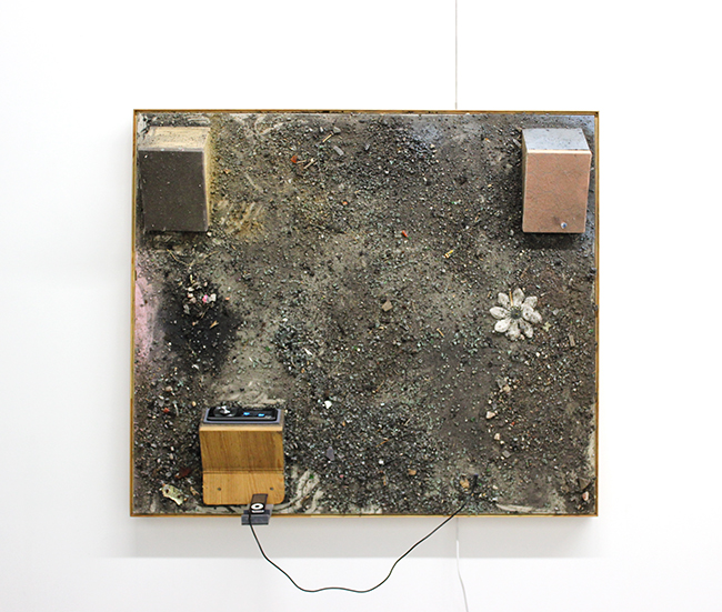  Jeff Degolier,&nbsp; More than Feeling, &nbsp;detail, 2012, autoglass, gravel, parking lot debris, car stereo on drywall 