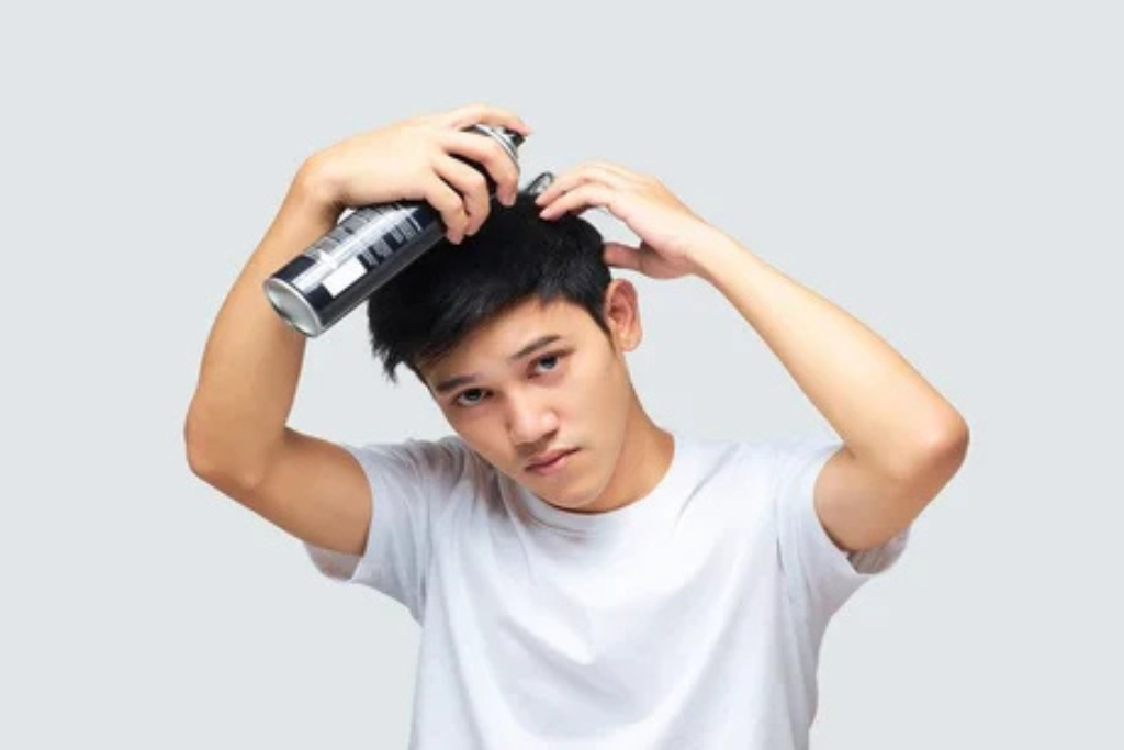Man Using Best Hair Sprays for Hairs Growth