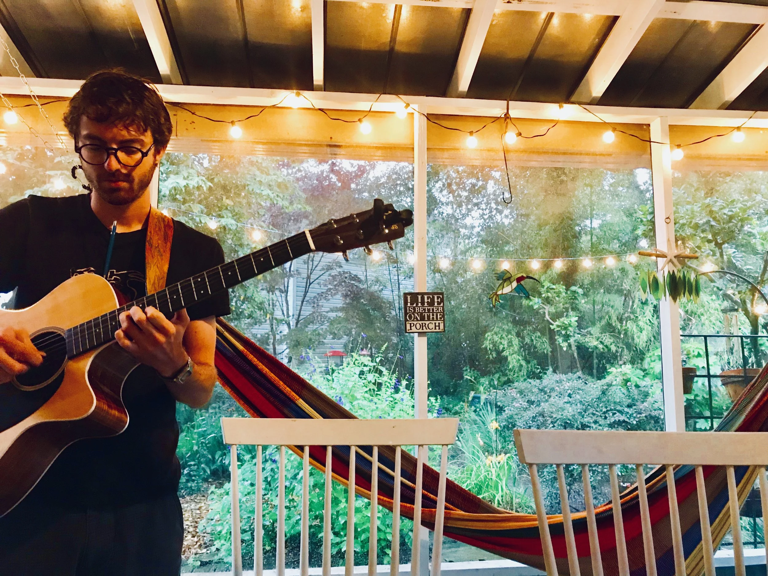 Eli living his best life on the porch in Wilmington, NC
