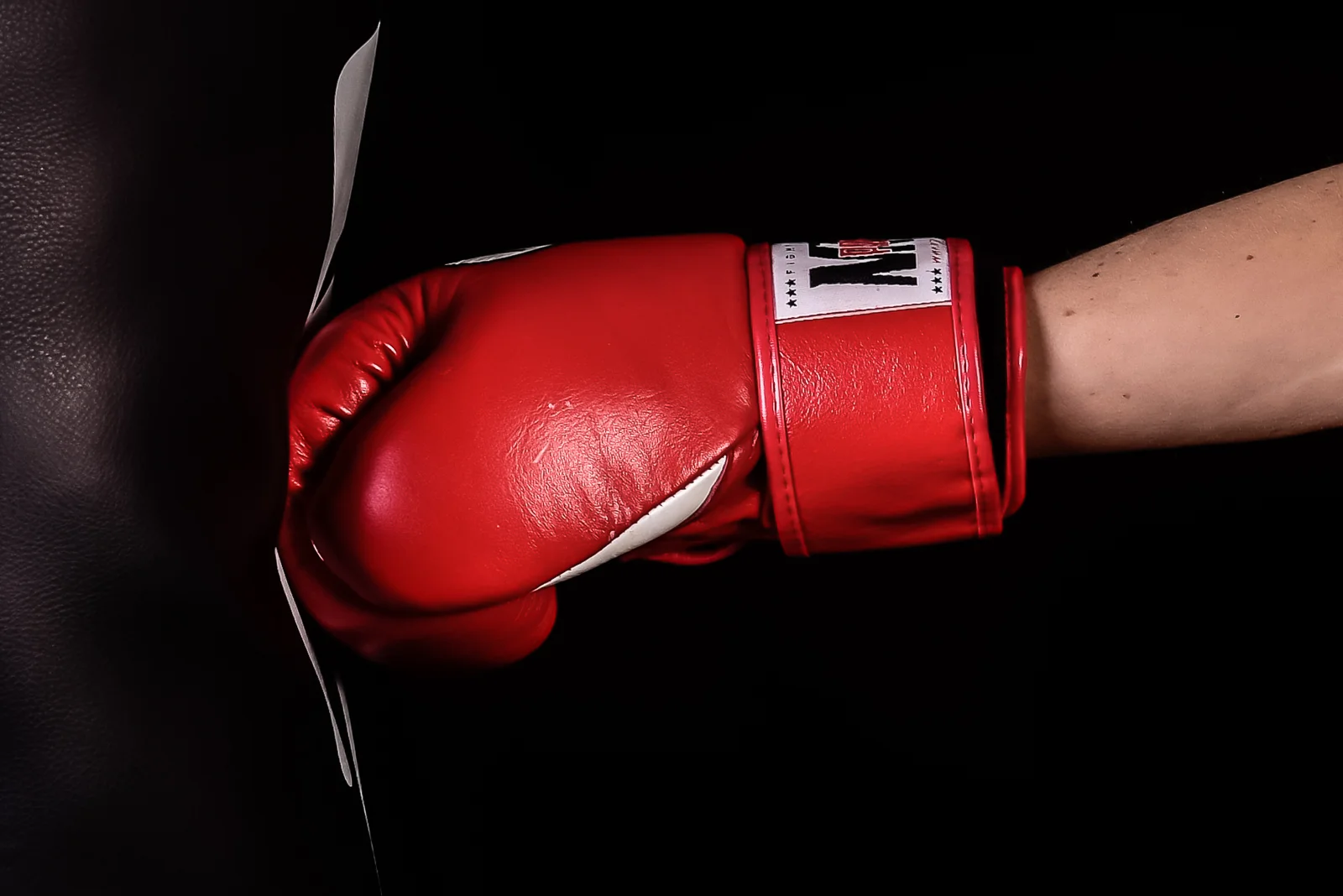 Boxing glove striking a bag - photo by David Ellard