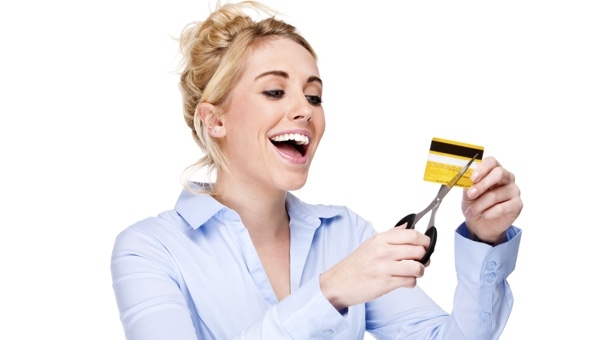 Nothing makes you smile quite like cutting up a credit card in a stock photo