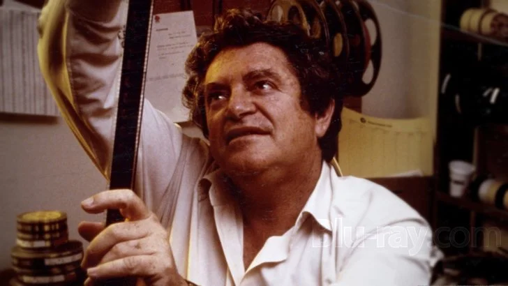 Surely no man who stares lovingly at reels of film could be all bad! 