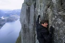Get off that rock wall, Tom Cruise! You're gonna plummet to your death! 