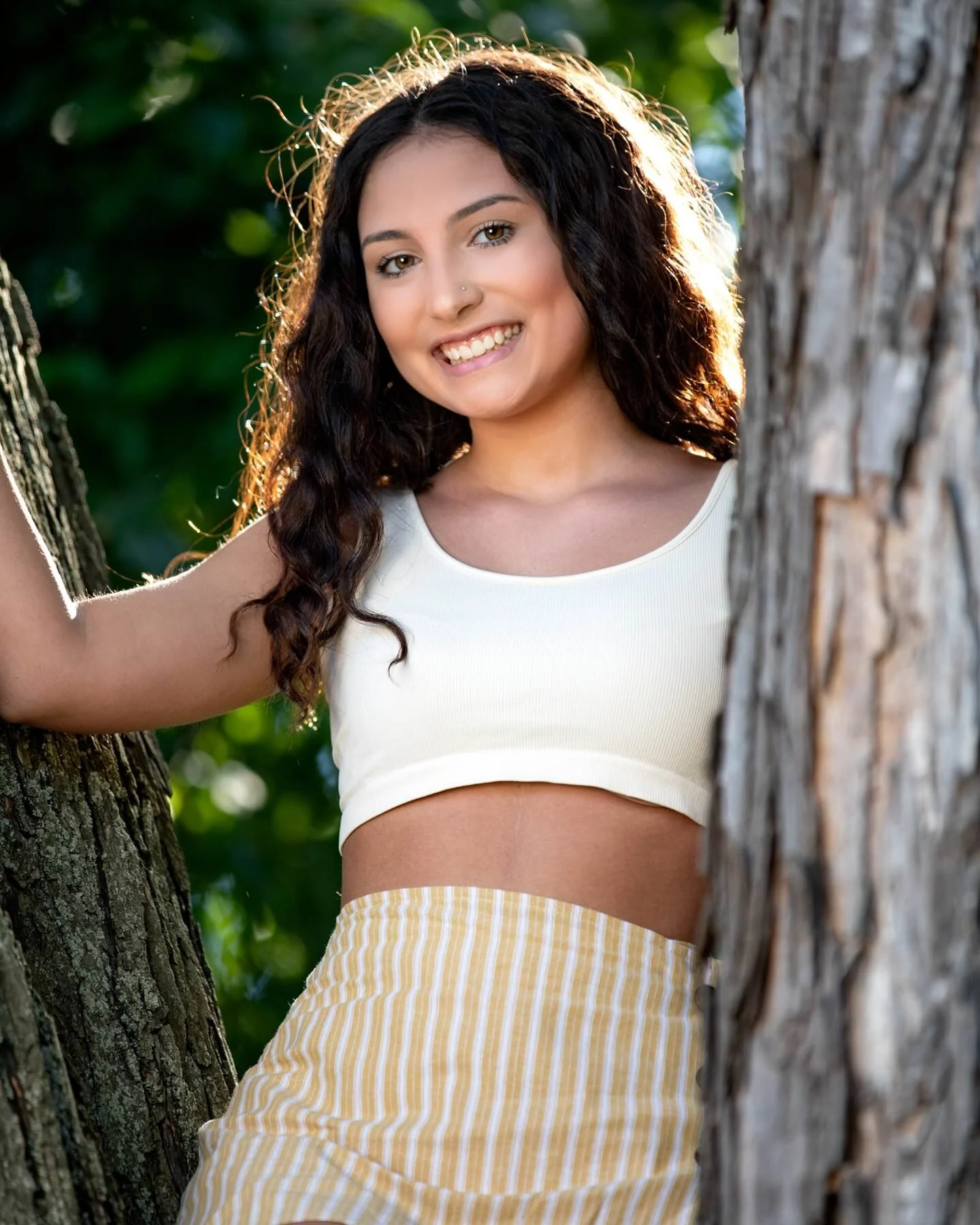 Claire’s senior portrait in the “Tree of Death” at Cutler Gardens in Binghamton. (Canon 5D Mk IV, 70-200 2.8L, 1/200 sec at F / 2.8, ISO 100 at 200 mm, lit with Orlit RT-610 with Westcott RapidBox Medium and back-lit by the sun)