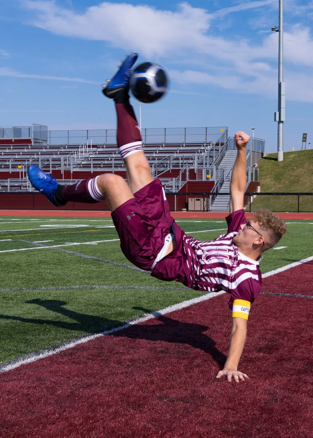 Lee rocking the bicycle kick on the turf at Johnson City High School. We had to run through a lot of these to get just the perfect moment of ball on foot. (Canon 5D Mk IV, 16-35 2.8L, 1/500 sec at F / 8.0, ISO 100 at 35 mm, naturally lit)