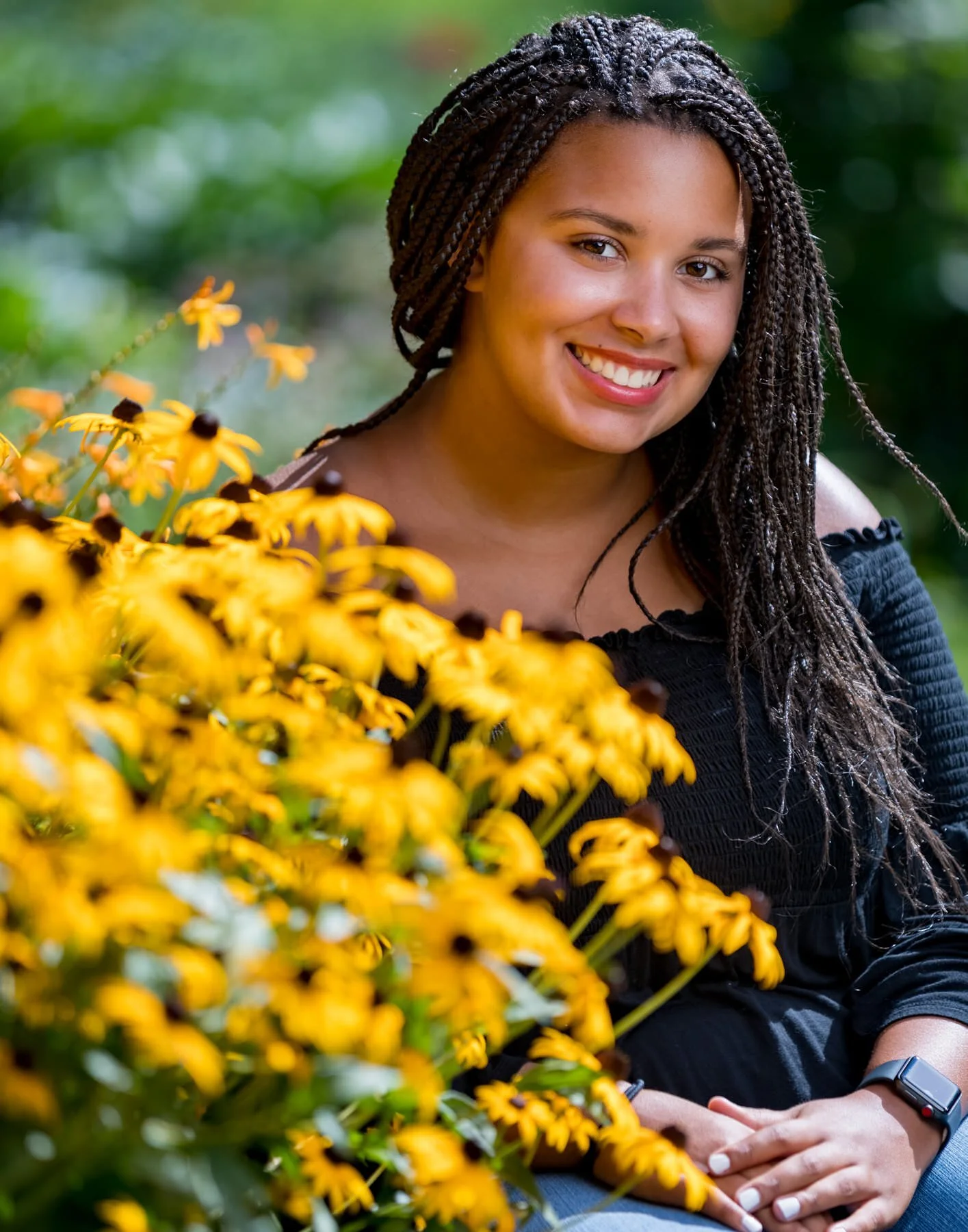 Jess posing in Cutler Gardens for her senior portraits. We shot this one using high speed synch on the strobe to get that shallow depth of field of the 2.8 aperture to make her stand out from the background and soften the foreground flowers. (Canon …
