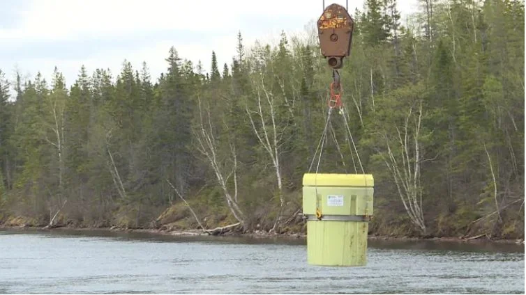 Kruger hauls decades-old barrels from the depths of Deer Lake's water supply