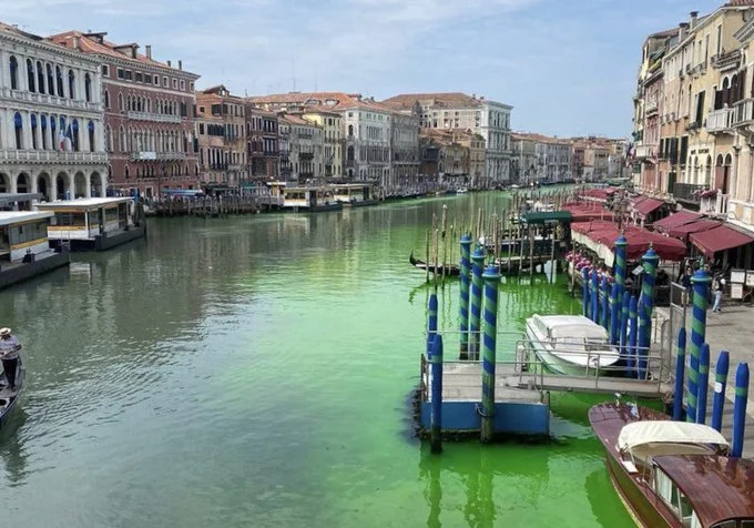 Venice authorities investigate after canal turns fluorescent green