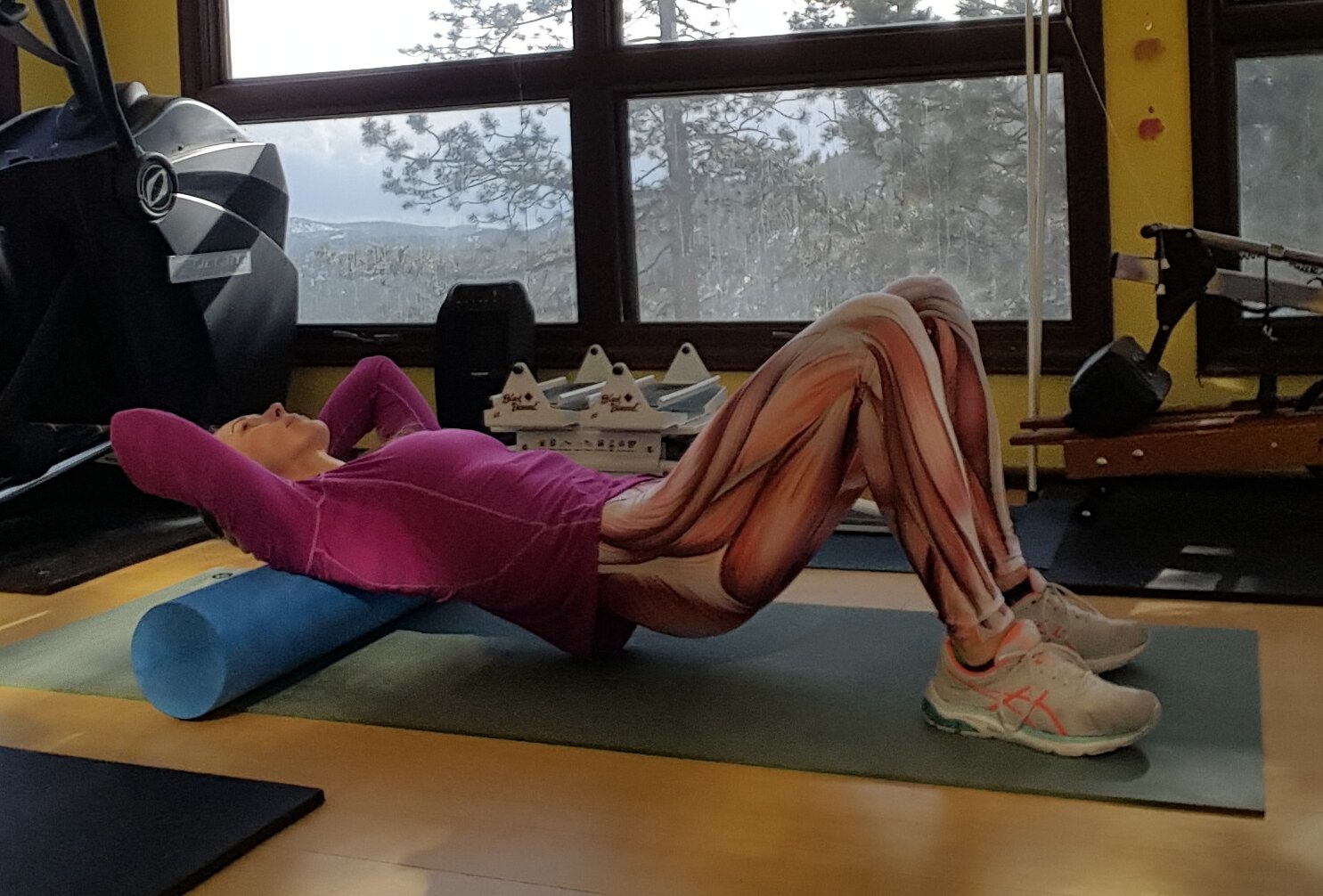 Robyn Fog is showing how to roll out your upper back using a foam roller