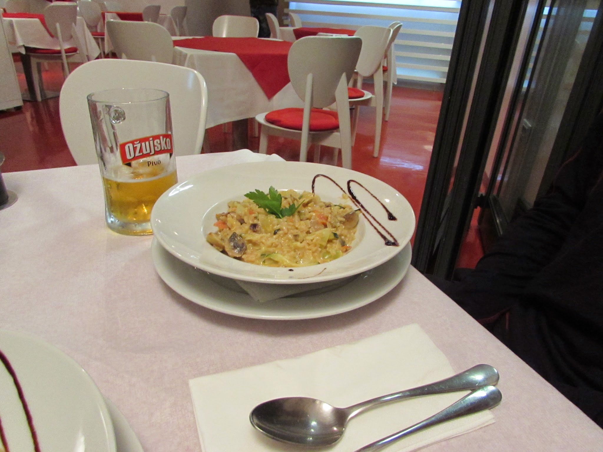 At the same restaraunt (in Fazana, north of Pula) Emmett got a carrot, onion, pepper, & mushroom risotto with some inexpensive Croatian beer.