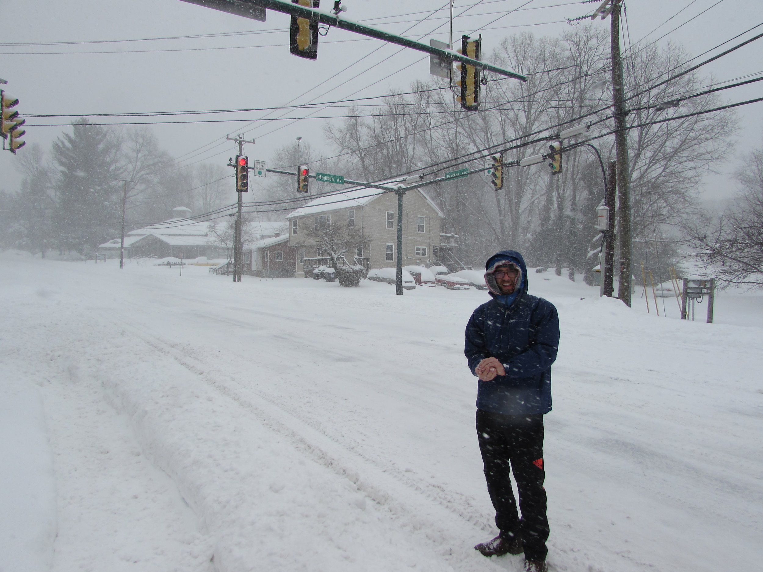 Emmett making a snowball in the middle of Preston Avenue during 2016's big snow.