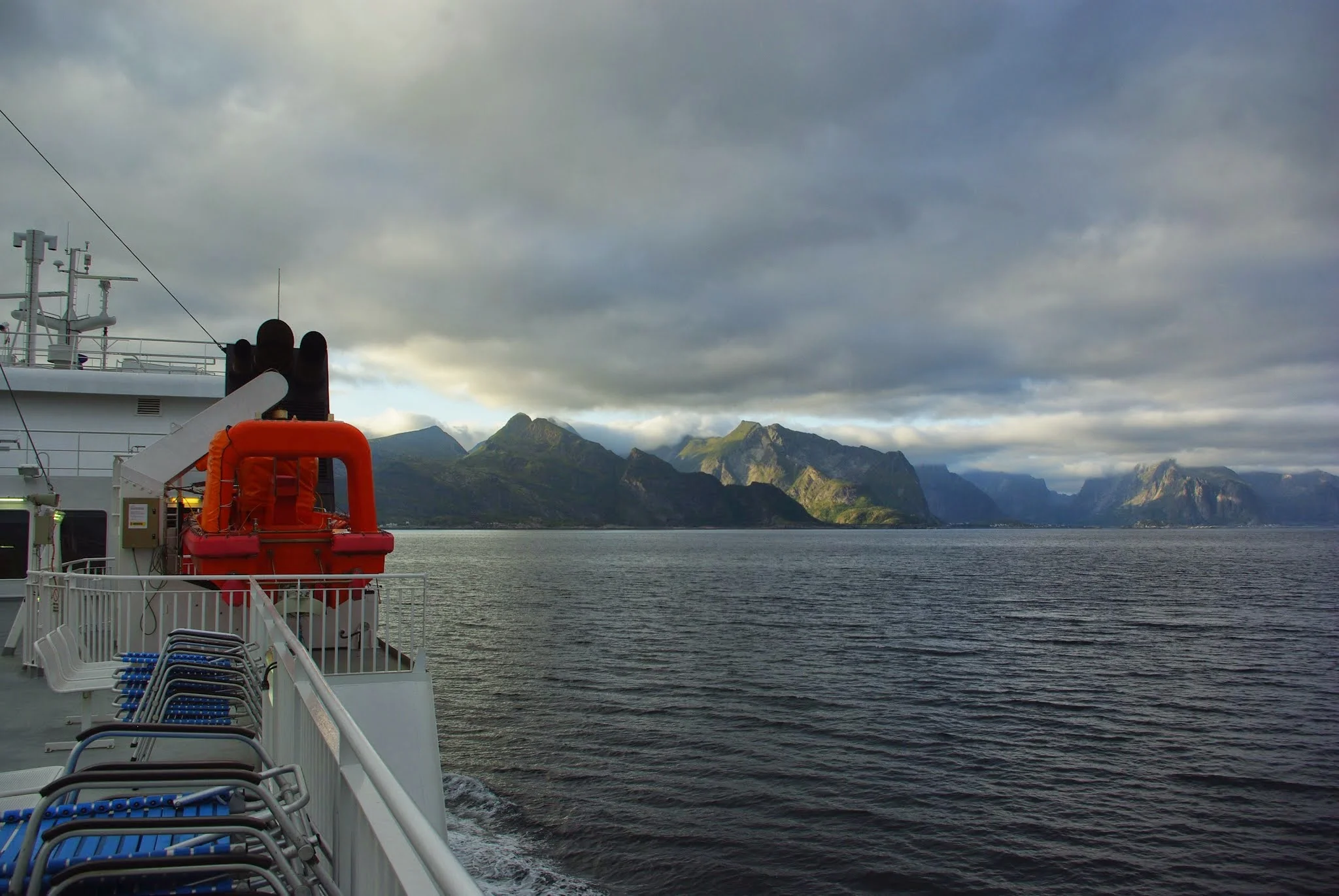 On the ferry from Bodø to Moskenes in the Lofoten archipelago. As the boat approached, the clouds parted and we got a small glimpse of the mountainous isles of Lofoten.