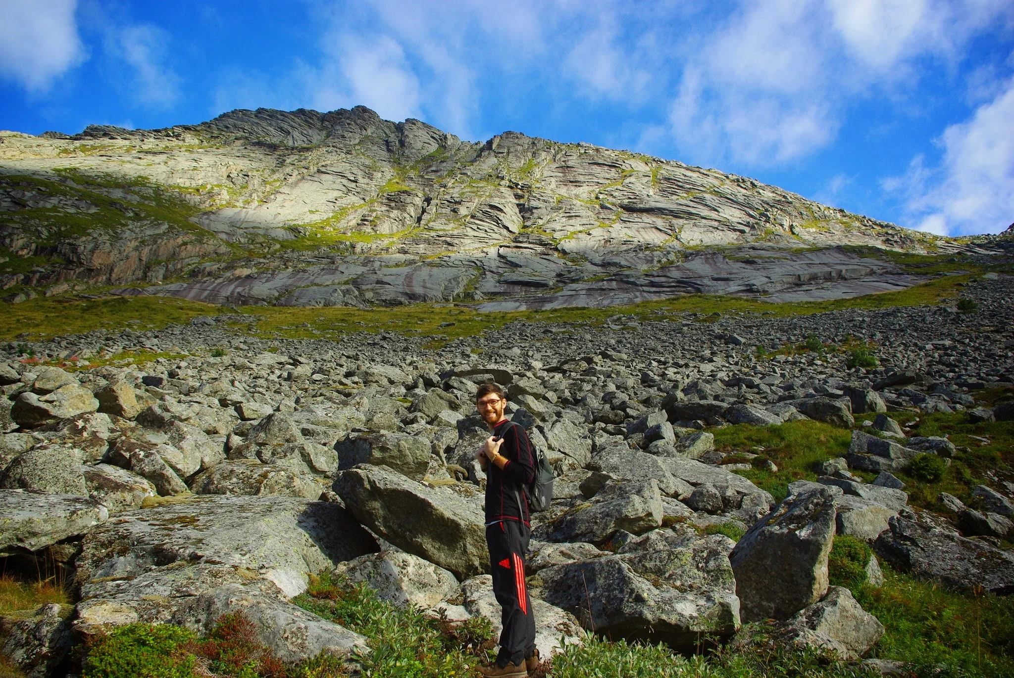 Early on in the Helvetsetind hike, there's a scree field to scramble across.