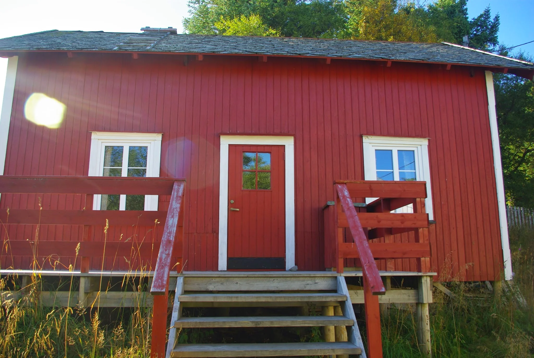 Our hostel digs in Å. Classic Scandinavian red rectangular cabin.