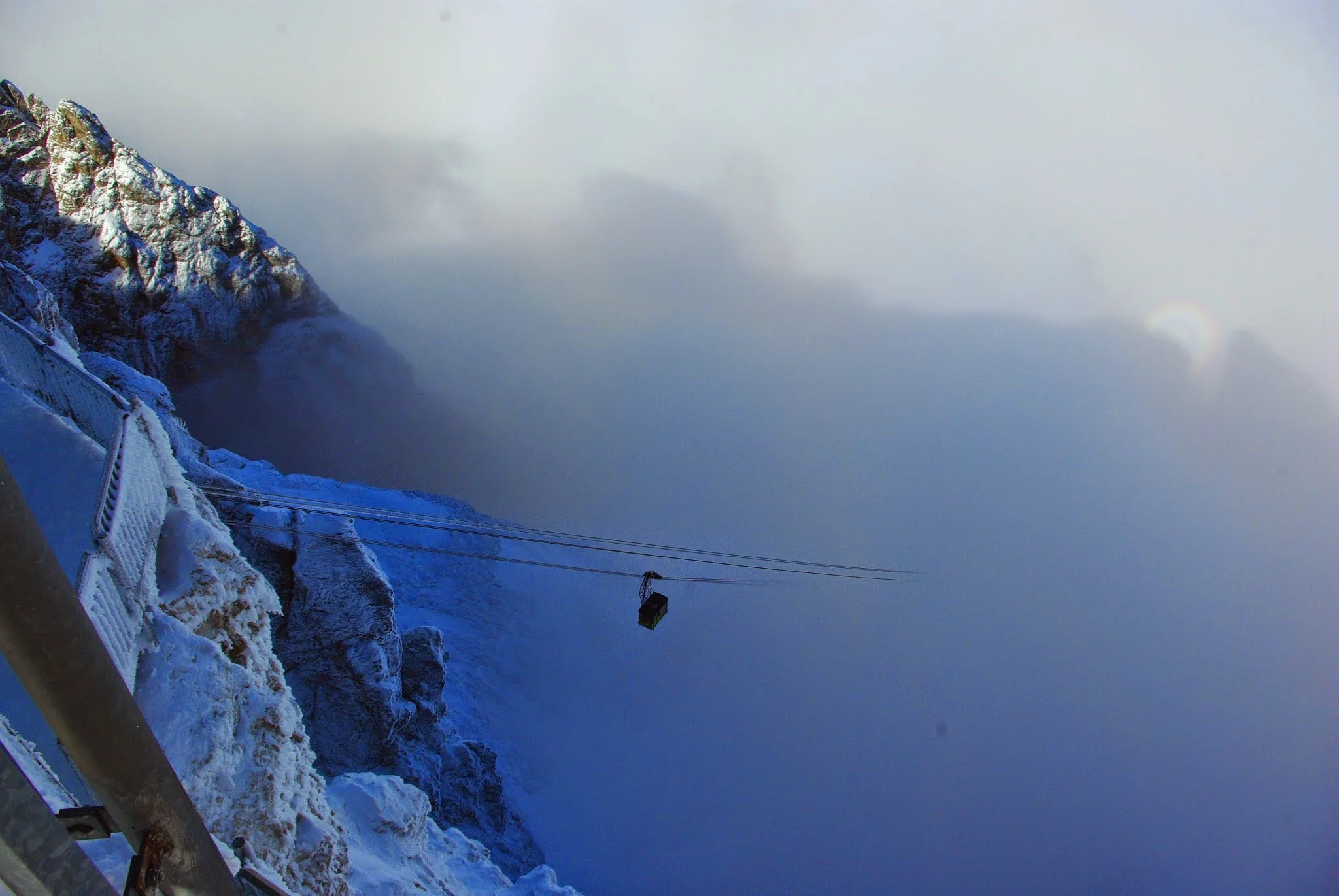 Out on the viewing platform, we got a pretty good glimpse of the same funicular descending back down into the cloudy abyss.