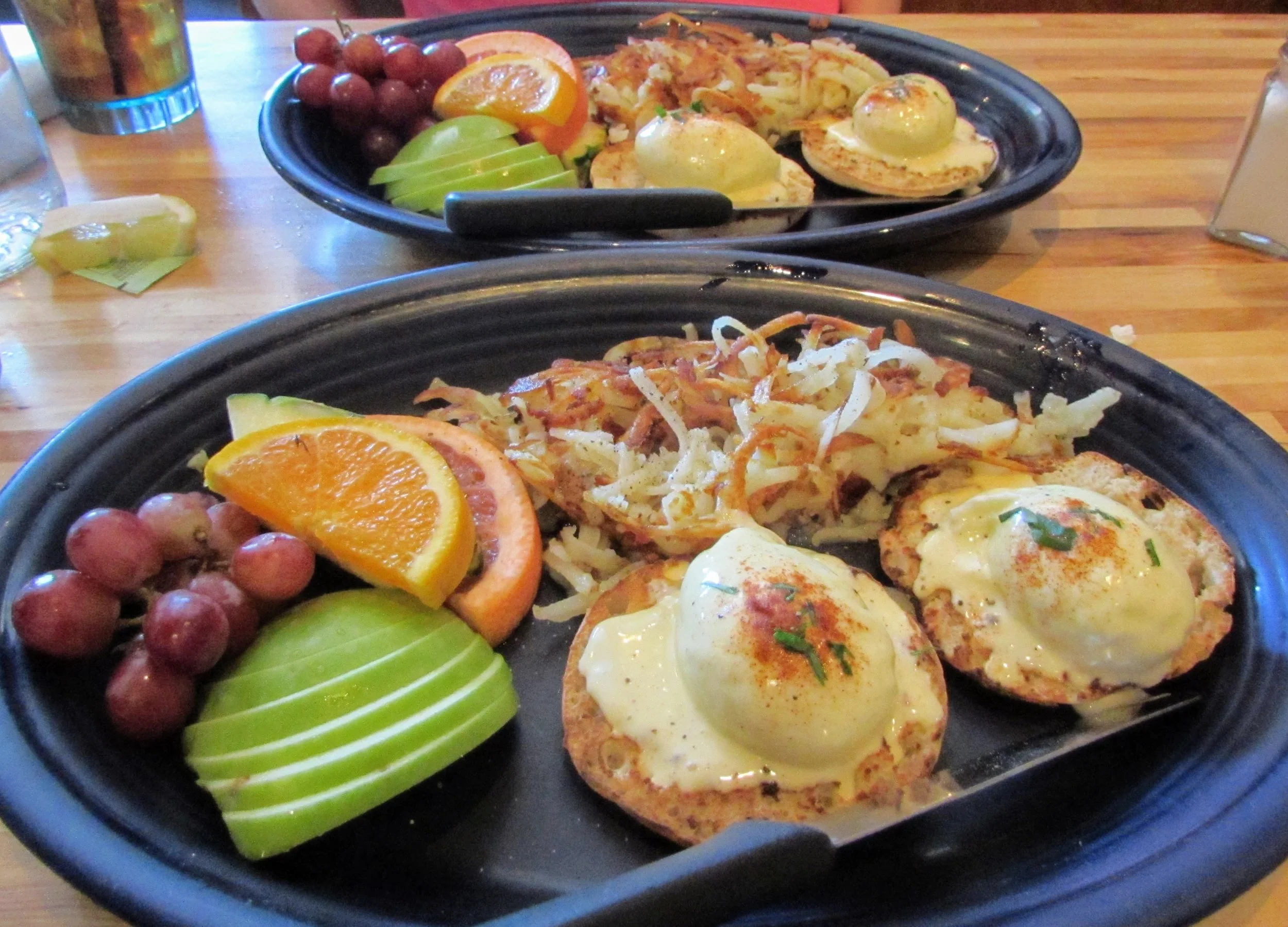 Eggs Benedict, hashbrowns, and fresh fruit: a tasty brunch from Hot Suppa.