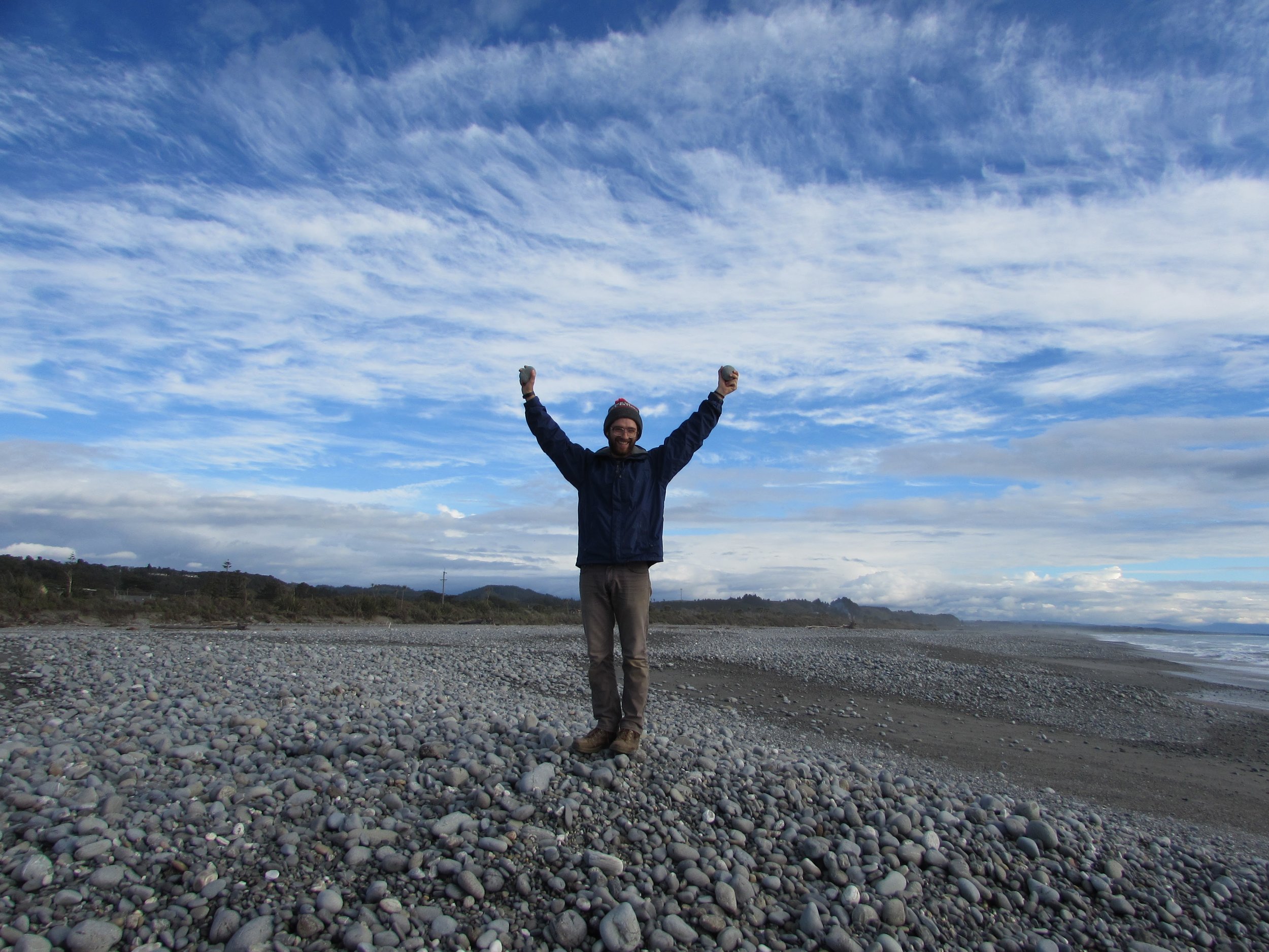 A triumphant Emmett on the rocky beach of Greymouth.