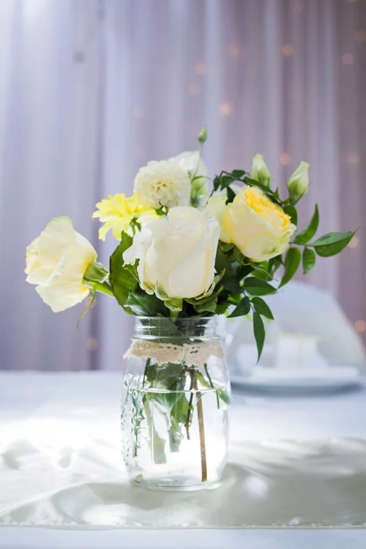 yellow-jar-flowers-centrepiece-auckland.jpg