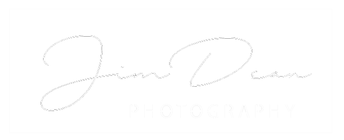 A black rectangular logo with a white border and white cursive text that reads "Jim Dean" followed by the word "PHOTOGRAPHY" in capital letters.